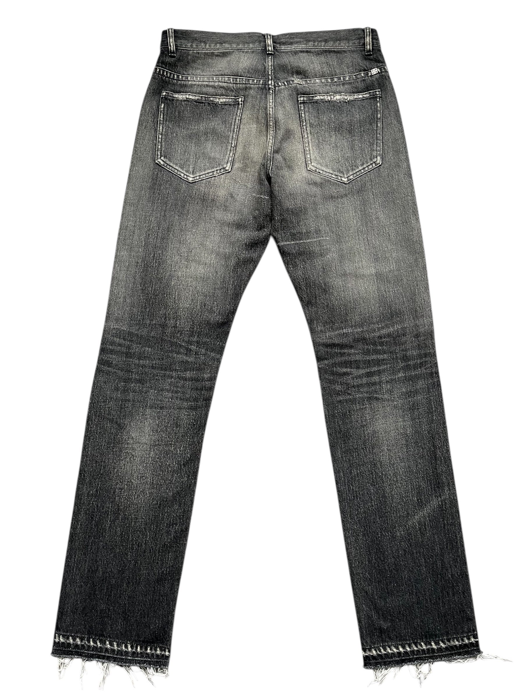 Givenchy FW23 distressed boro black denim pants with frayed details and worn-in look, front view showcasing classic denim style.