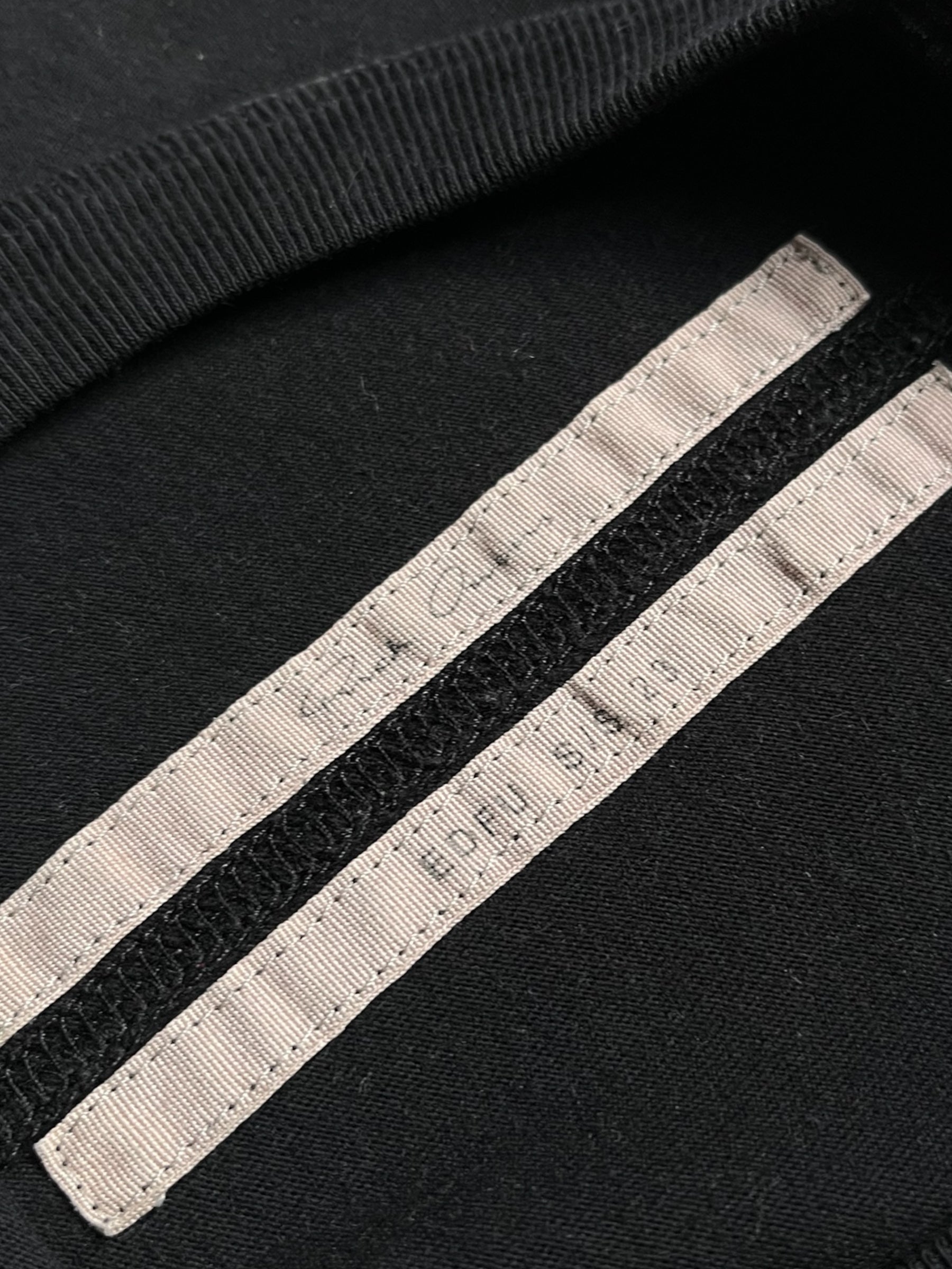 Rick Owens SS23 "EDFU" black T-shirt featuring a simple crew neck and minimalist design on soft fabric.