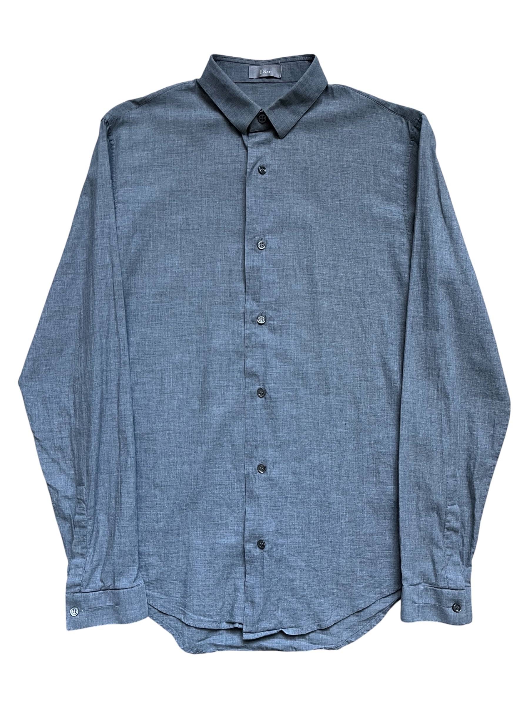 Dior SS06 herringbone shirt featuring classic pattern, button-up front, and tailored fit displayed on a hanger.