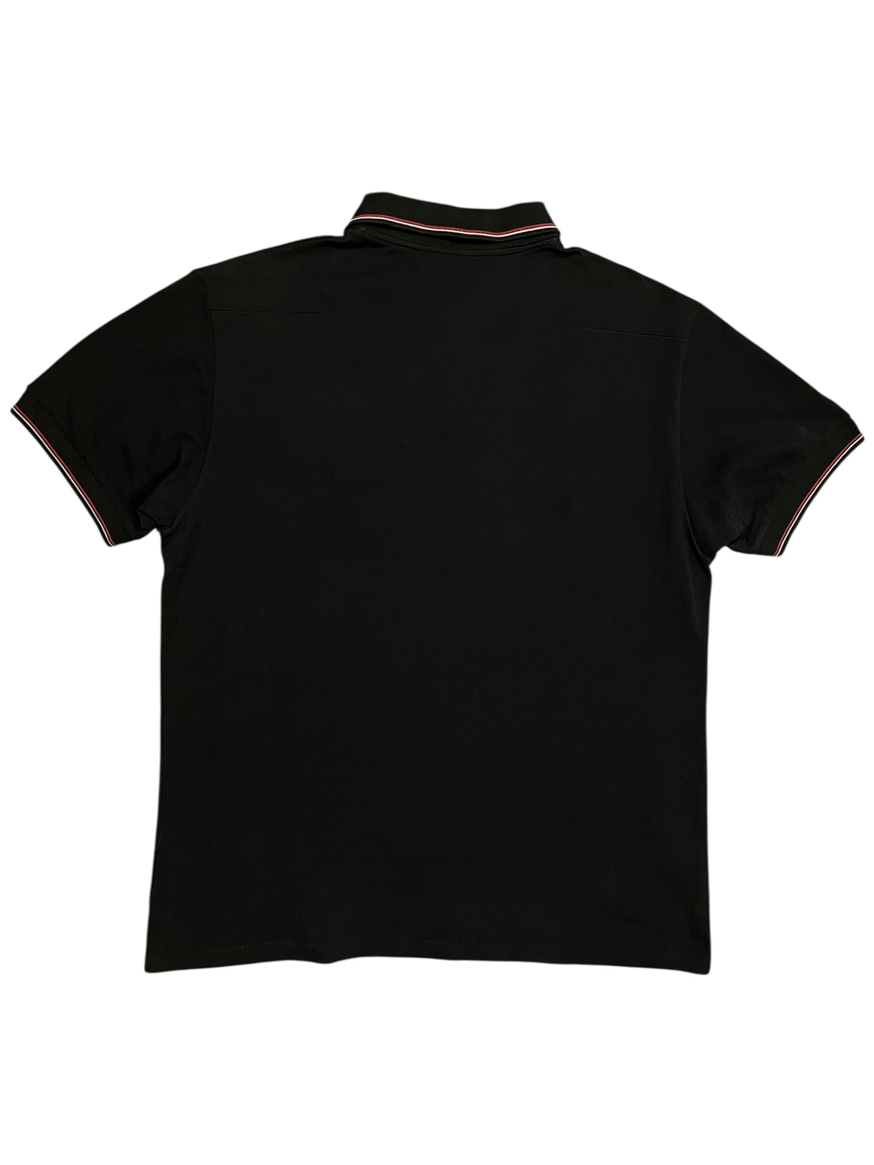 Dior SS07 Patch Polo shirt with embroidered patches, classic polo collar, and short sleeves, displayed on a neutral background.