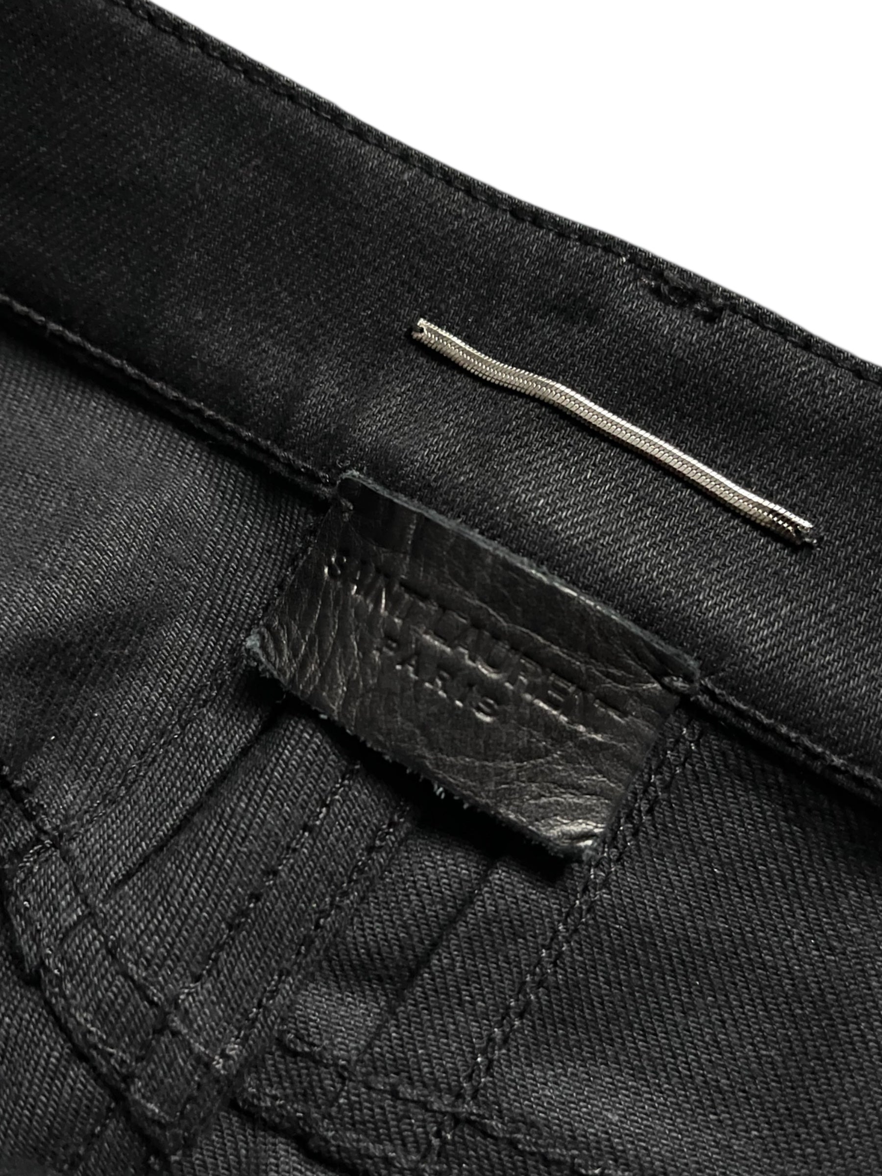 Saint Laurent AW15 Five Zips Biker Denim Pants with multiple zip details and classic biker style, shown on a model.