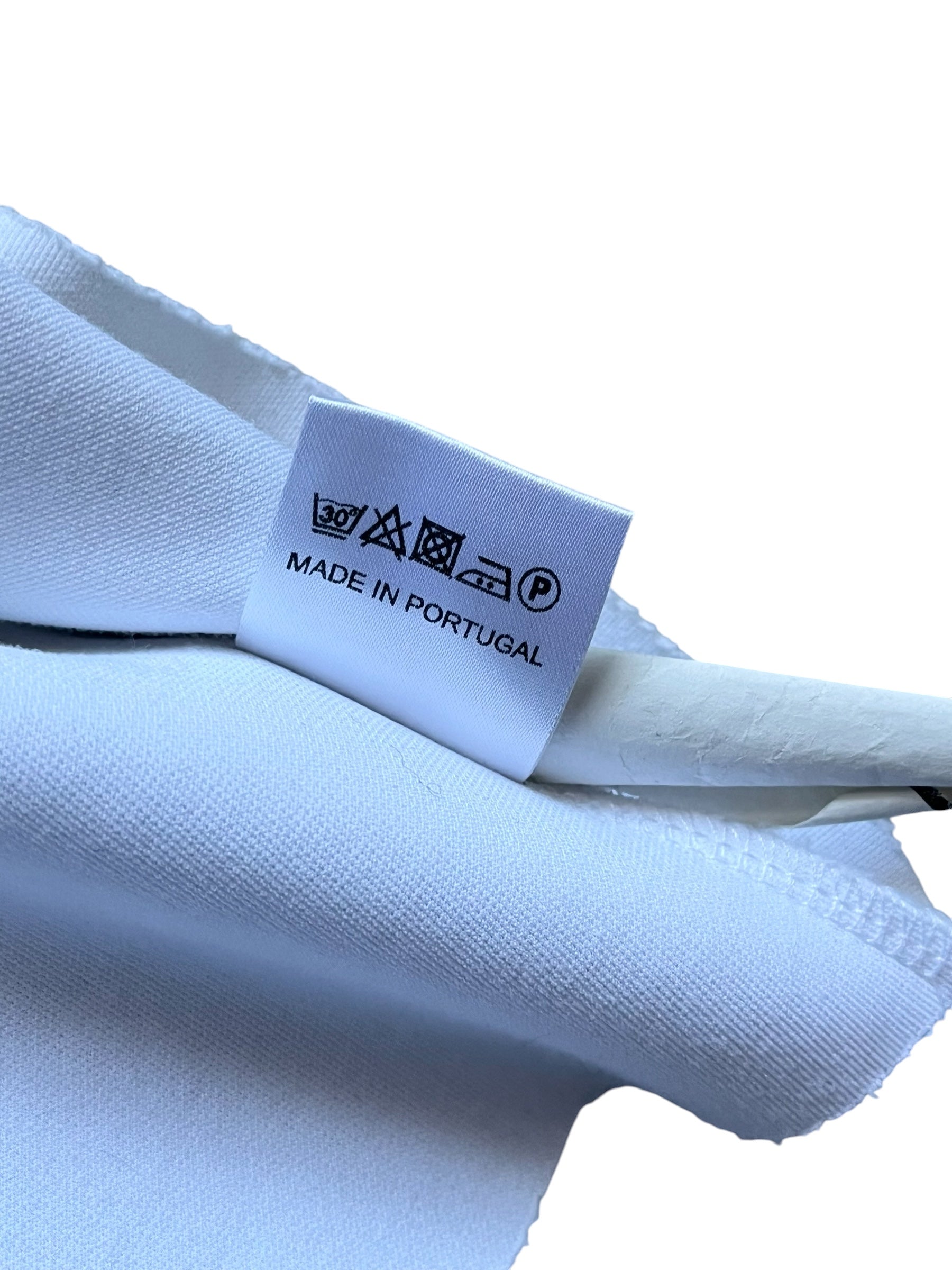 Raf Simons SS14 athletic neoprene T-shirt, black with modern design, close-up view of the stylish, fitted athletic T-shirt.