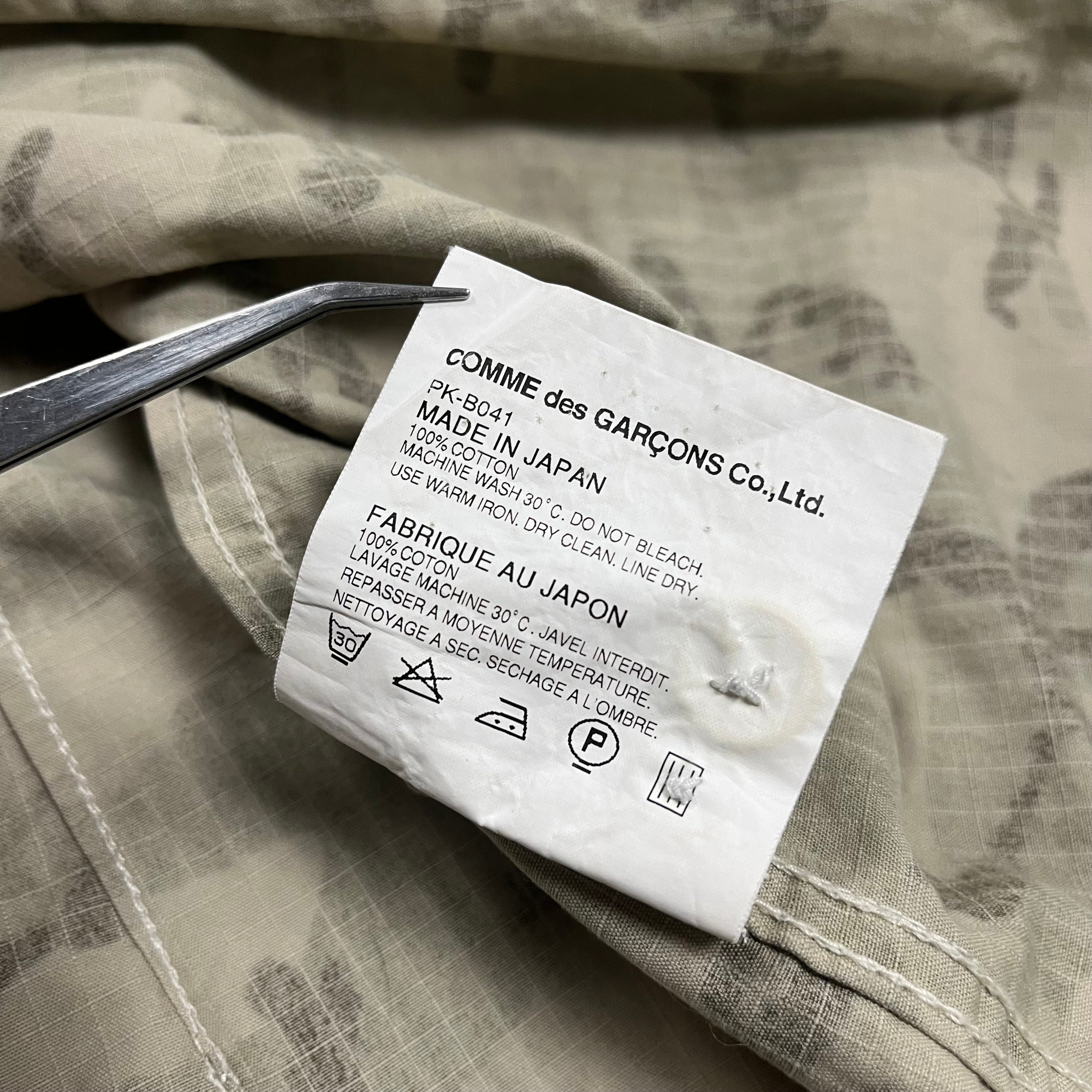 Comme des Garçons Homme Plus AW11 Ripstop Camo Shirt with military-inspired camouflage pattern and durable fabric.