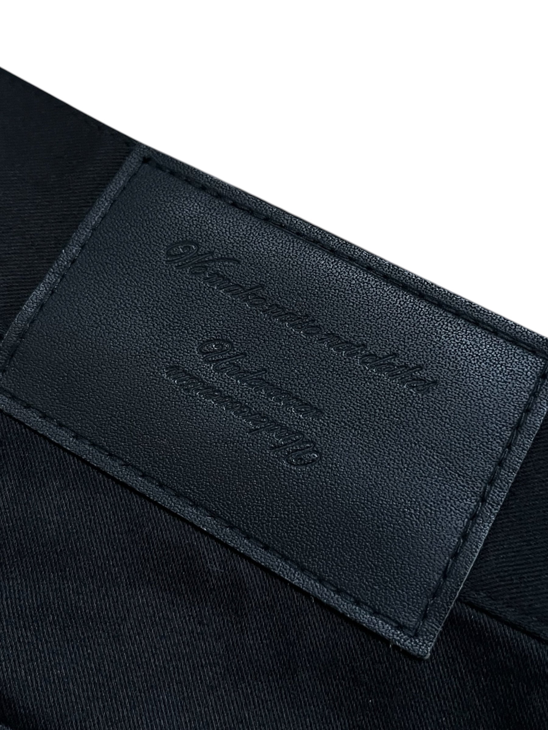 Undercover SS23 Bright Side of the Dark Side SCAB distressed denim jeans with ripped details and a faded, worn look.