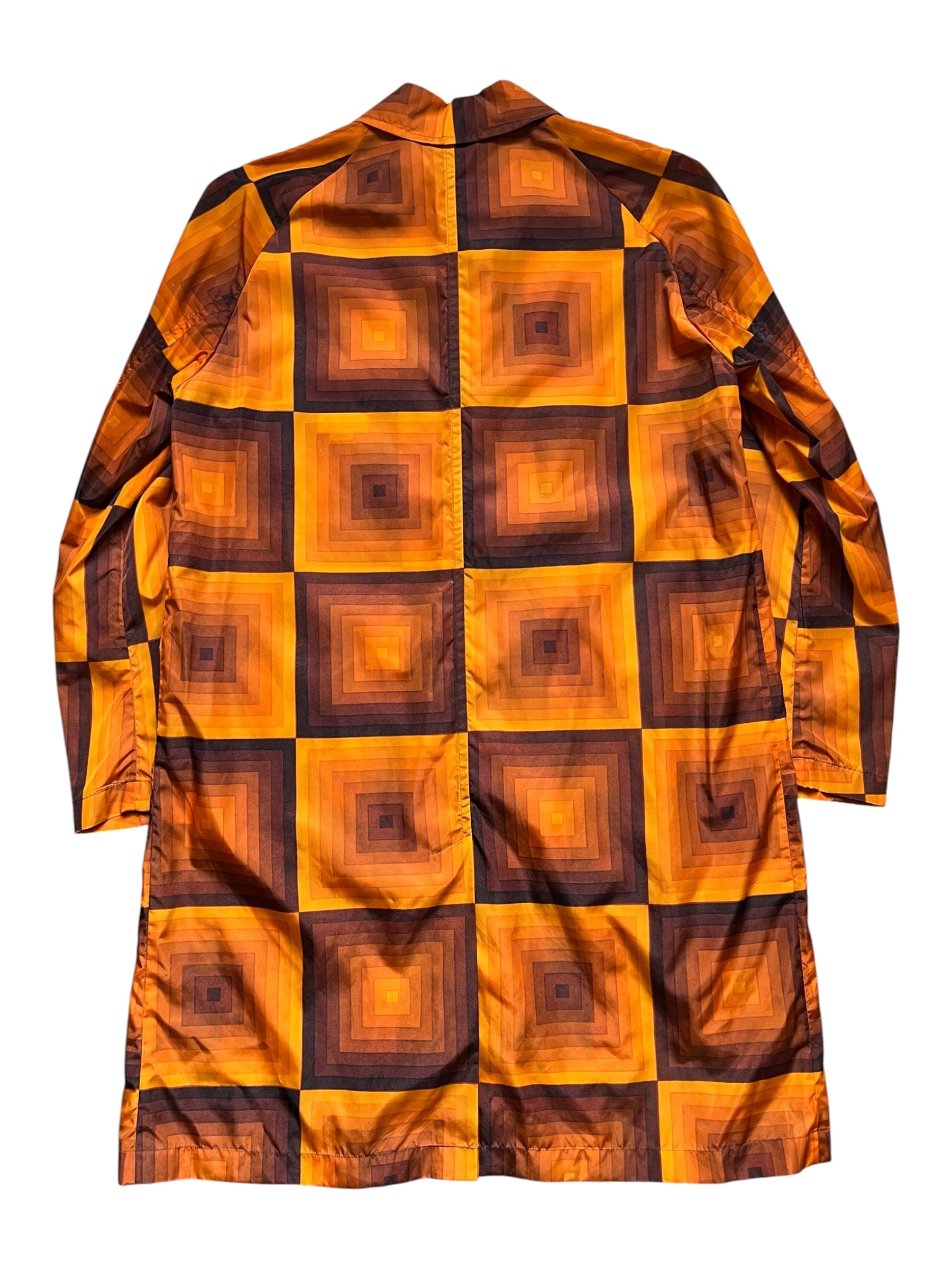 Dries Van Noten SS19 Verner Panton nylon coat displayed on a hanger, showcasing its sleek design and vibrant color.