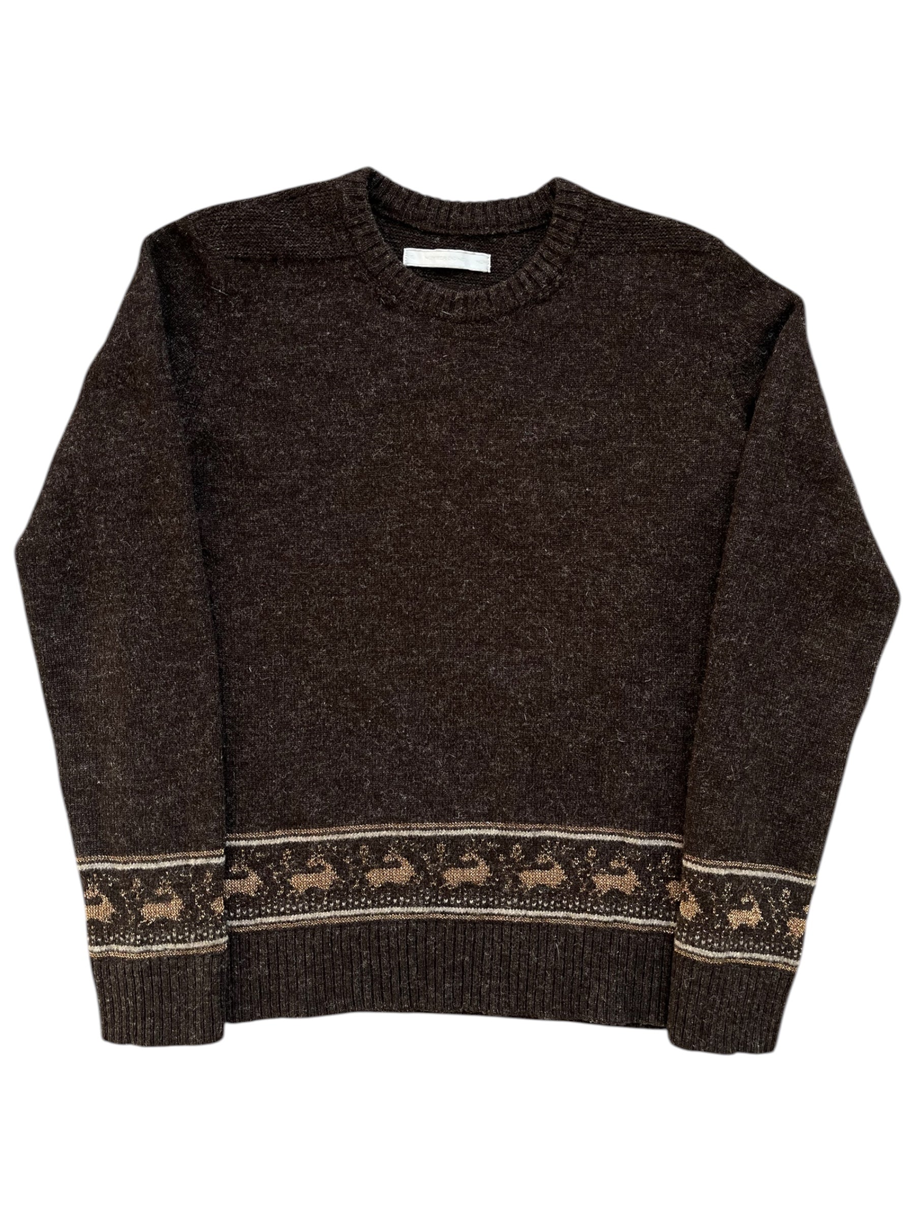 Number (N)ine AW02 “Nowhere Man” reindeer wool knit sweater, detailed close-up of the textured knit fabric and reindeer pattern.
