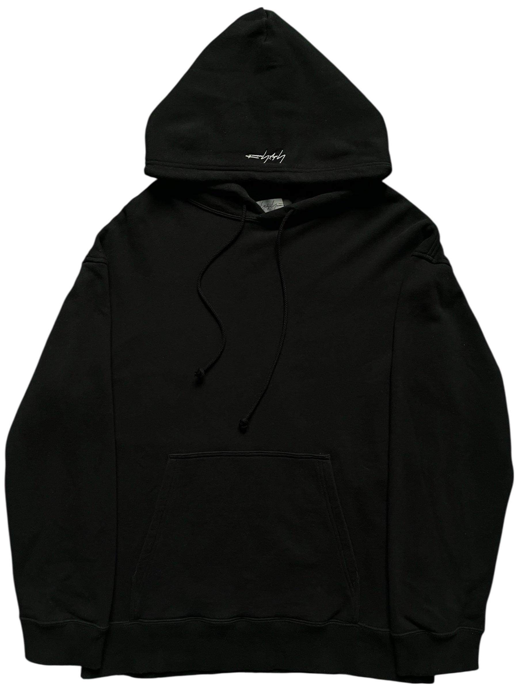 Yohji Yamamoto SS24 black signature hoodie with minimalist design and soft fabric, front view showing logo detail