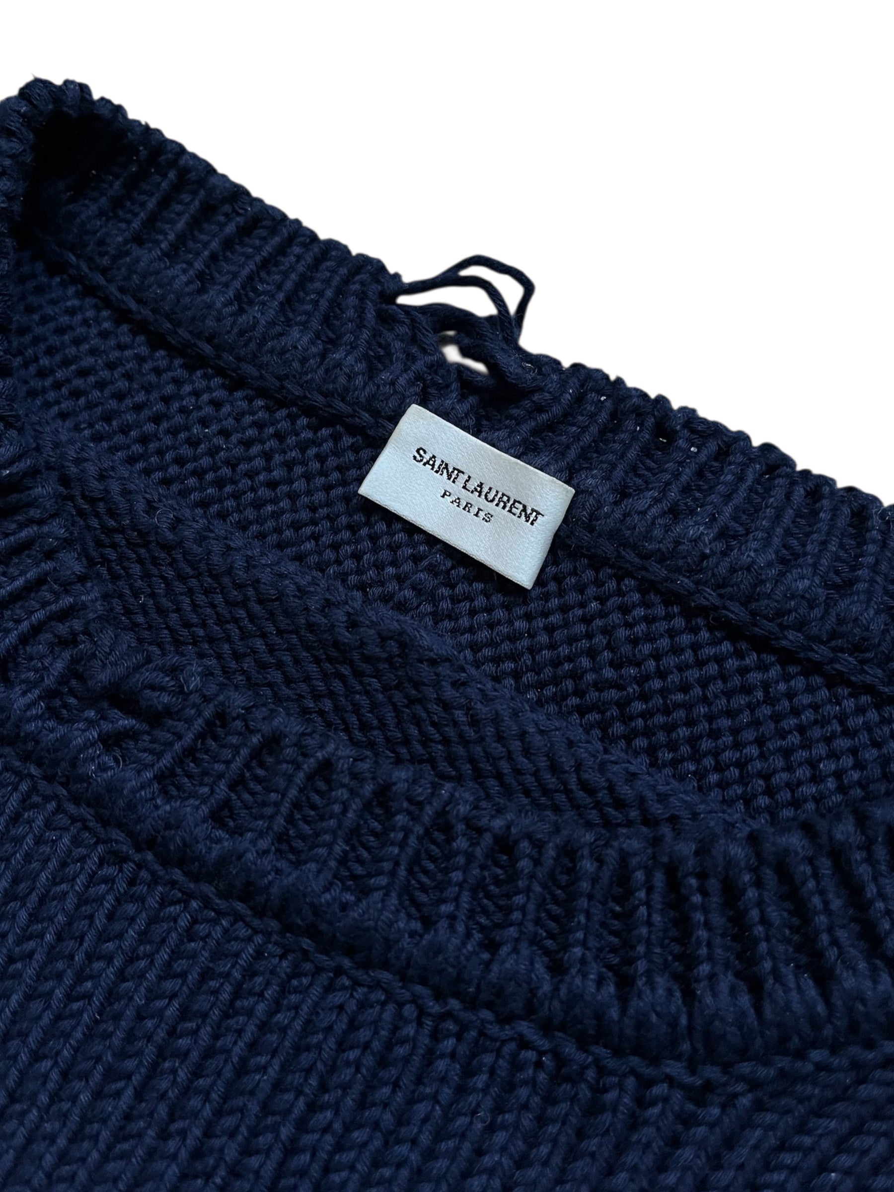 Saint Laurent AW23 navy distressed knit sweater with a textured, stylish design and ribbed cuffs and neckline.