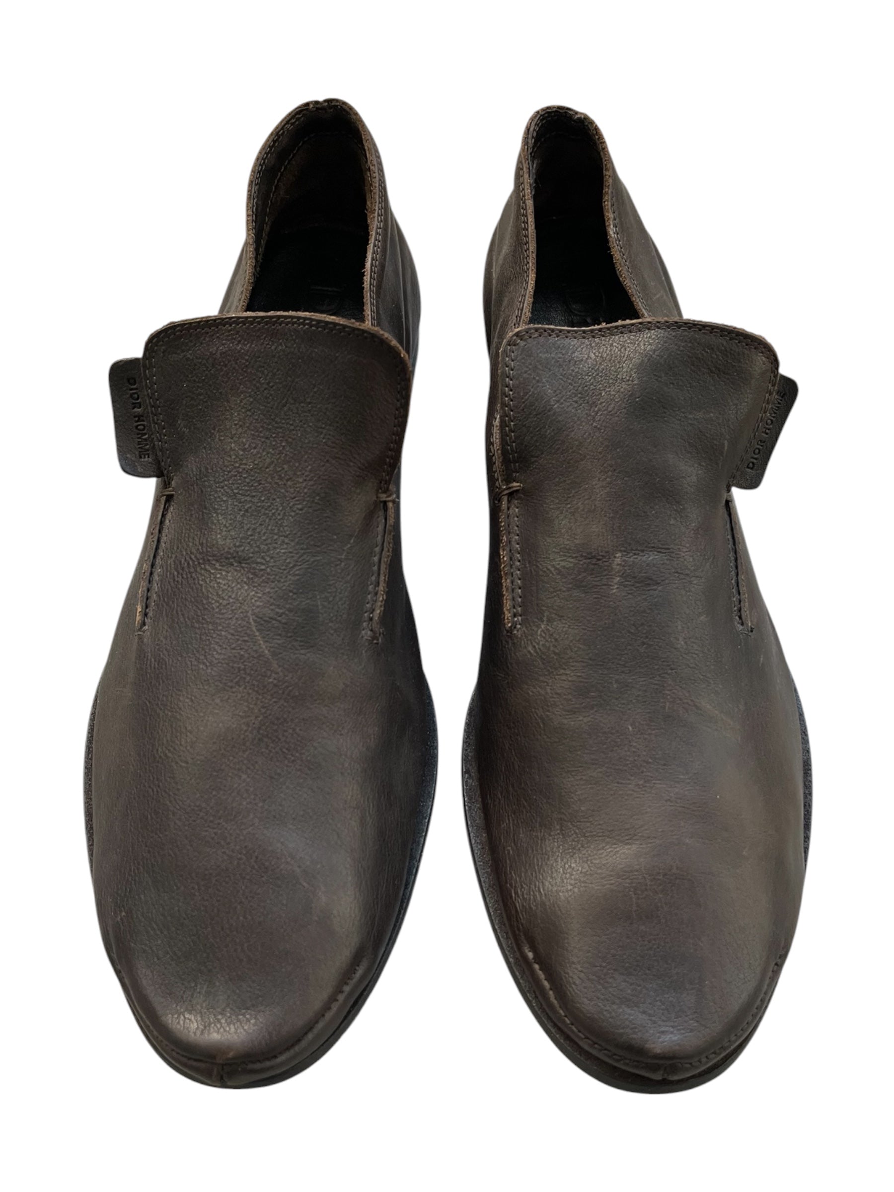 Dior SS05 brown calfskin loafers with sleek design and classic stitching, displayed on a neutral background.
