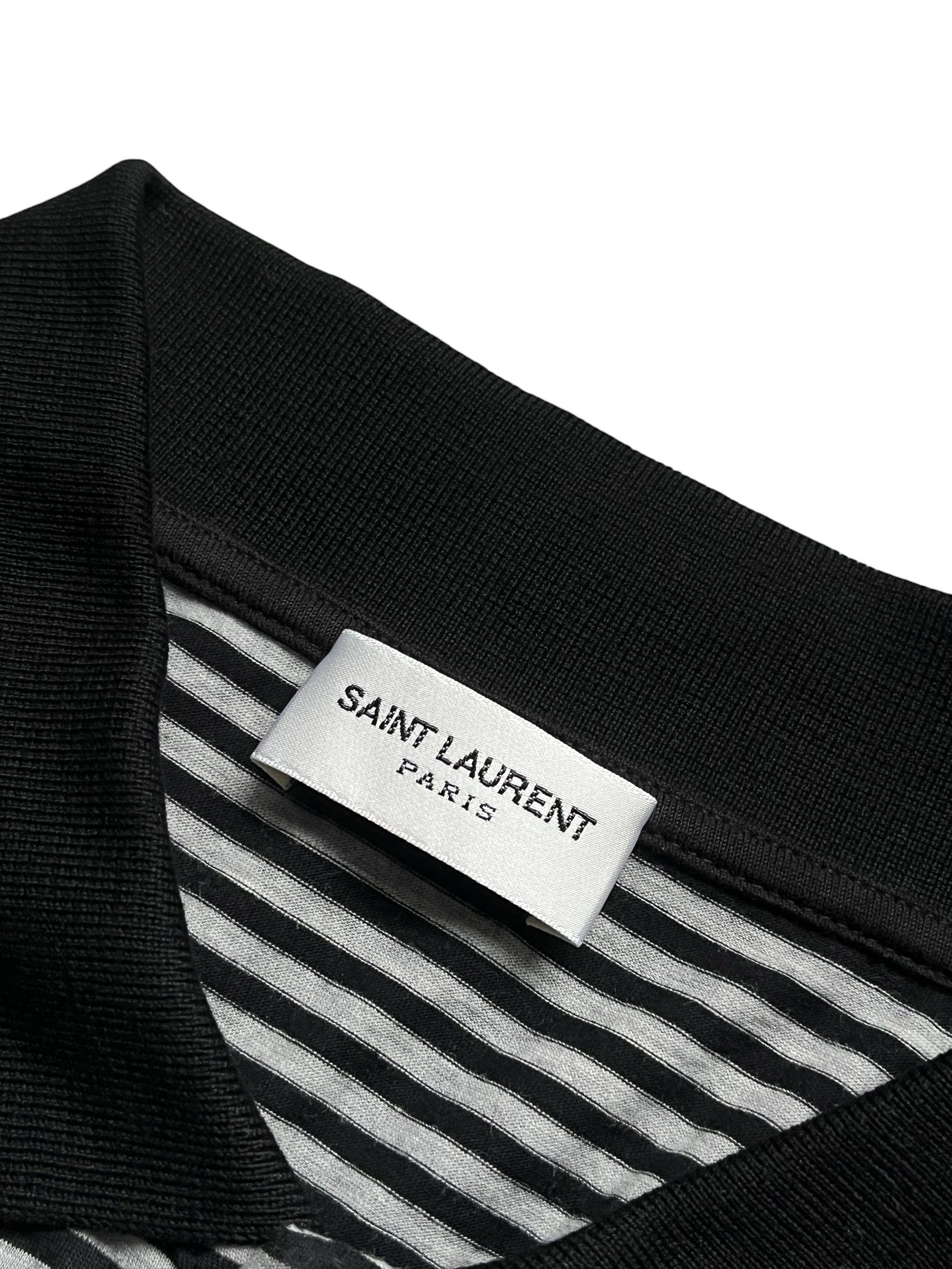 Saint Laurent SS20 black striped pocket polo shirt with short sleeves and classic collar, styled casually.