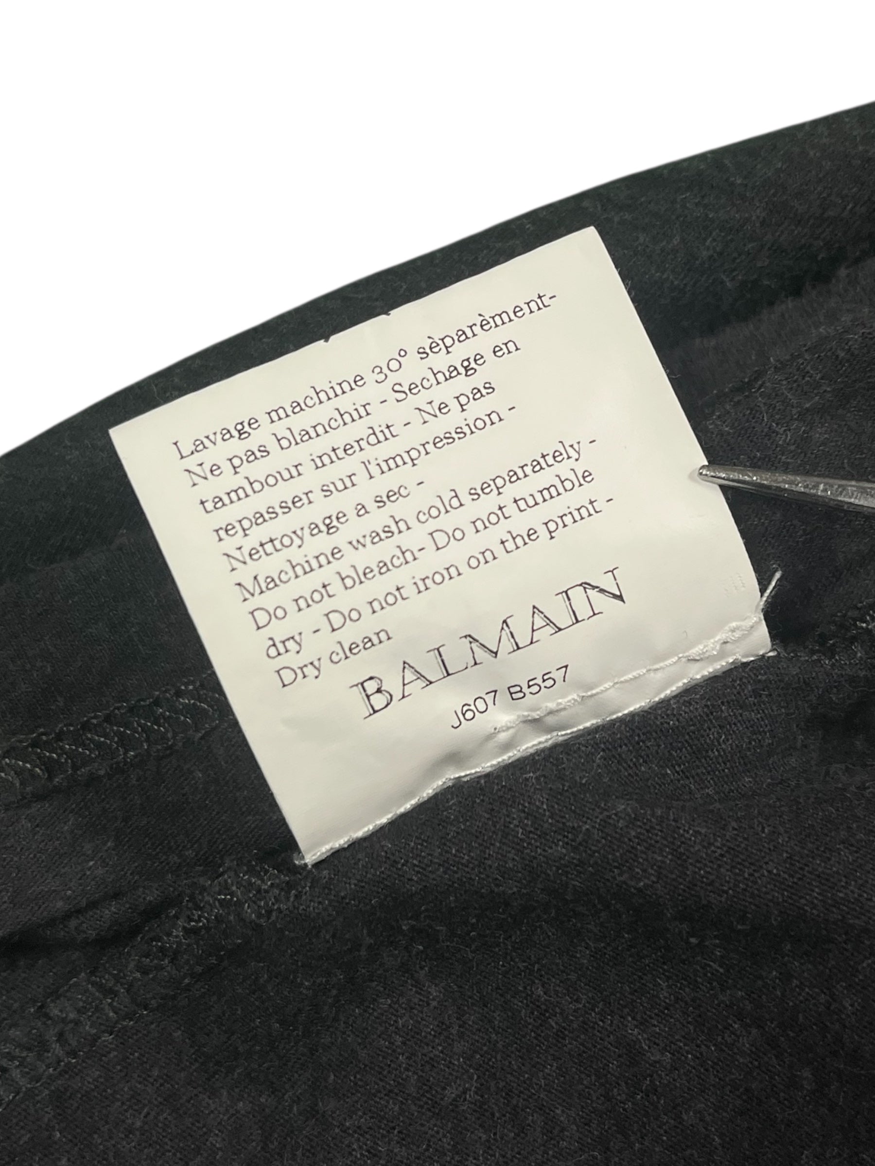 Balmain AW12 distressed T-shirt with a casual fit and edgy design, featuring worn-out details and a modern streetwear style.
