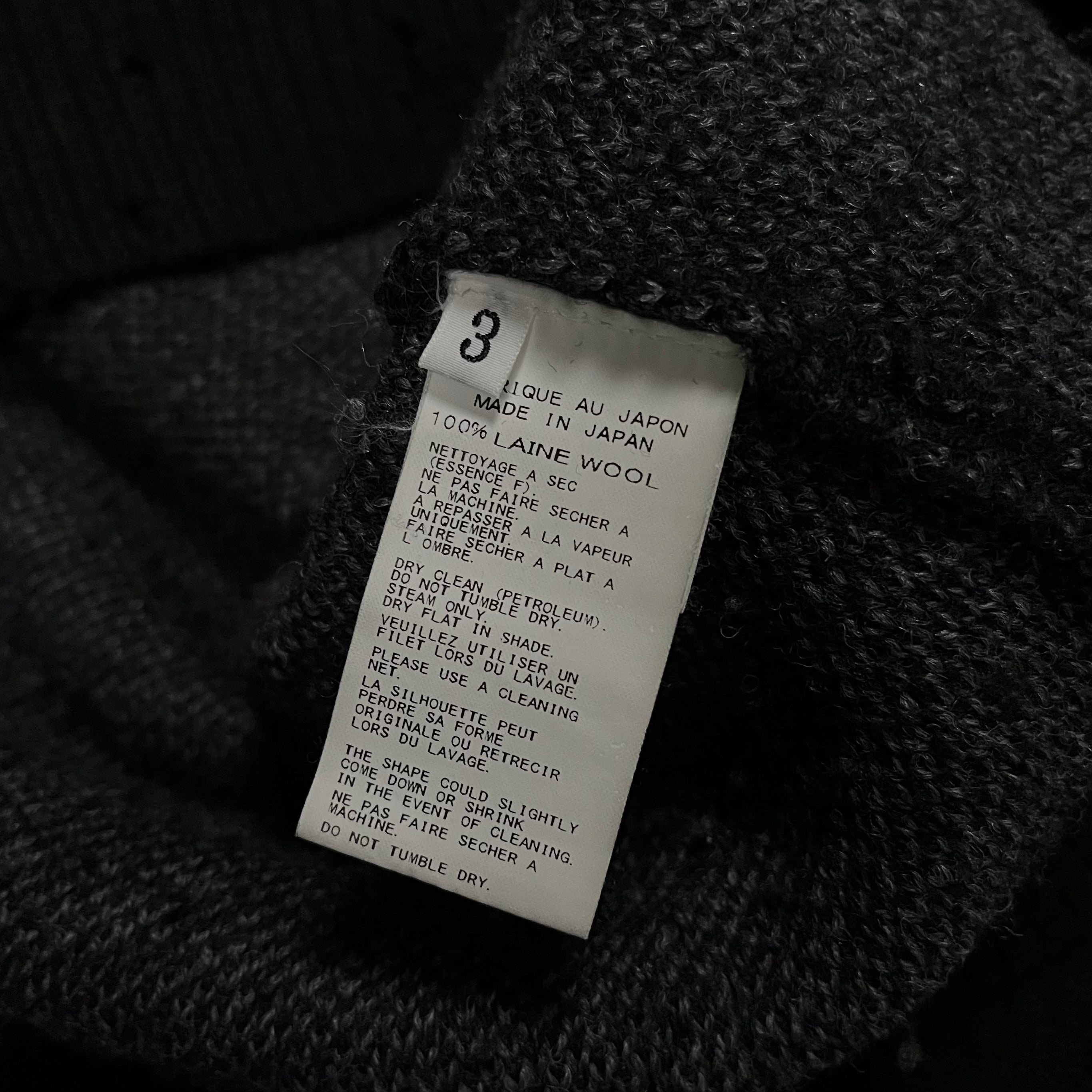 Yohji Yamamoto AW15 distressed wool knit sweater featuring a textured, worn-in design and ribbed collar and cuffs.