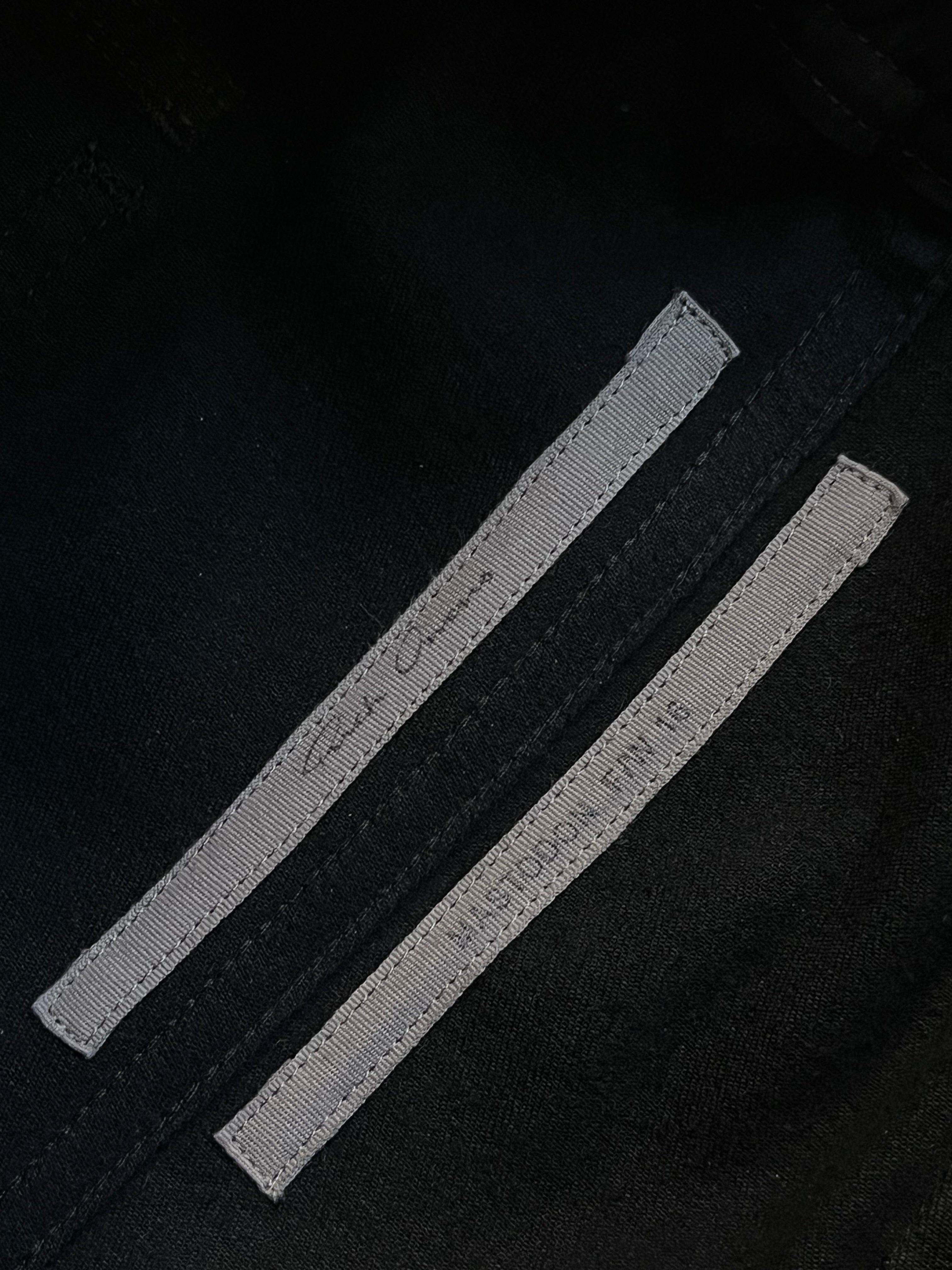 Rick Owens FW16 Mastodon cargo jogger pants with multiple pockets and relaxed fit, shown in dark fabric with detailed stitching.