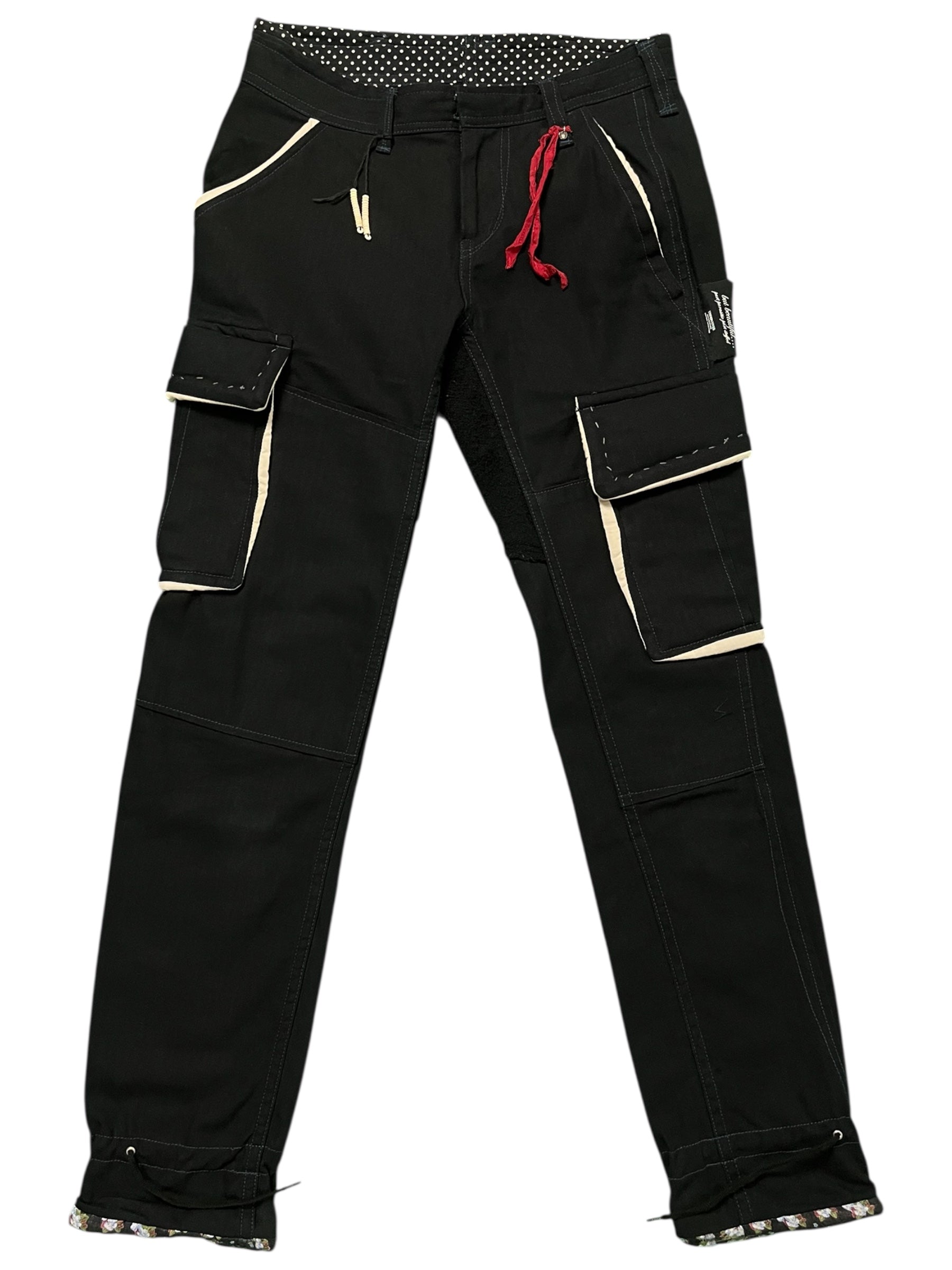 Undercover AW04 "But Beautiful" cargo pants featuring parasitic and stuffed details, with a relaxed fit and unique design elements.
