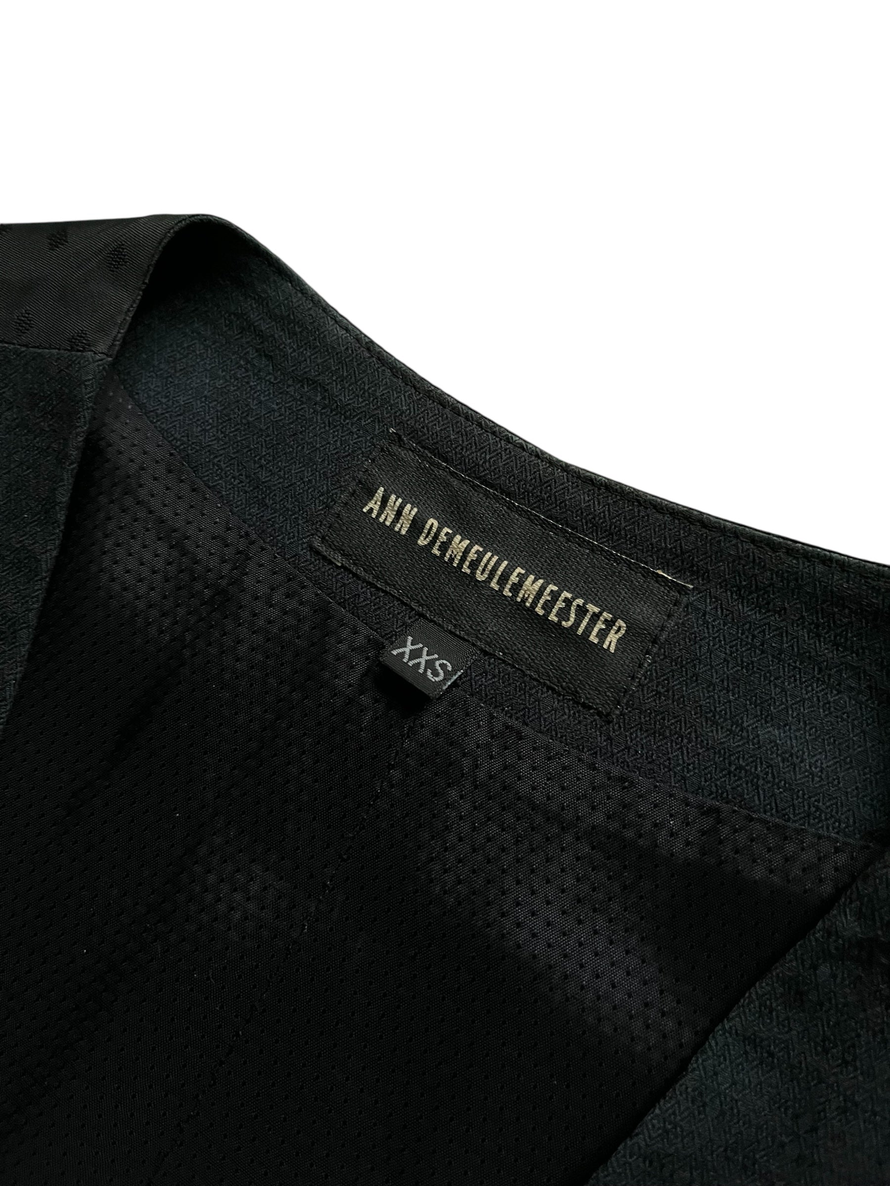 Navy wool vest by Ann Demeulemeester, featuring a tailored fit and classic sleeveless design, worn over a shirt.