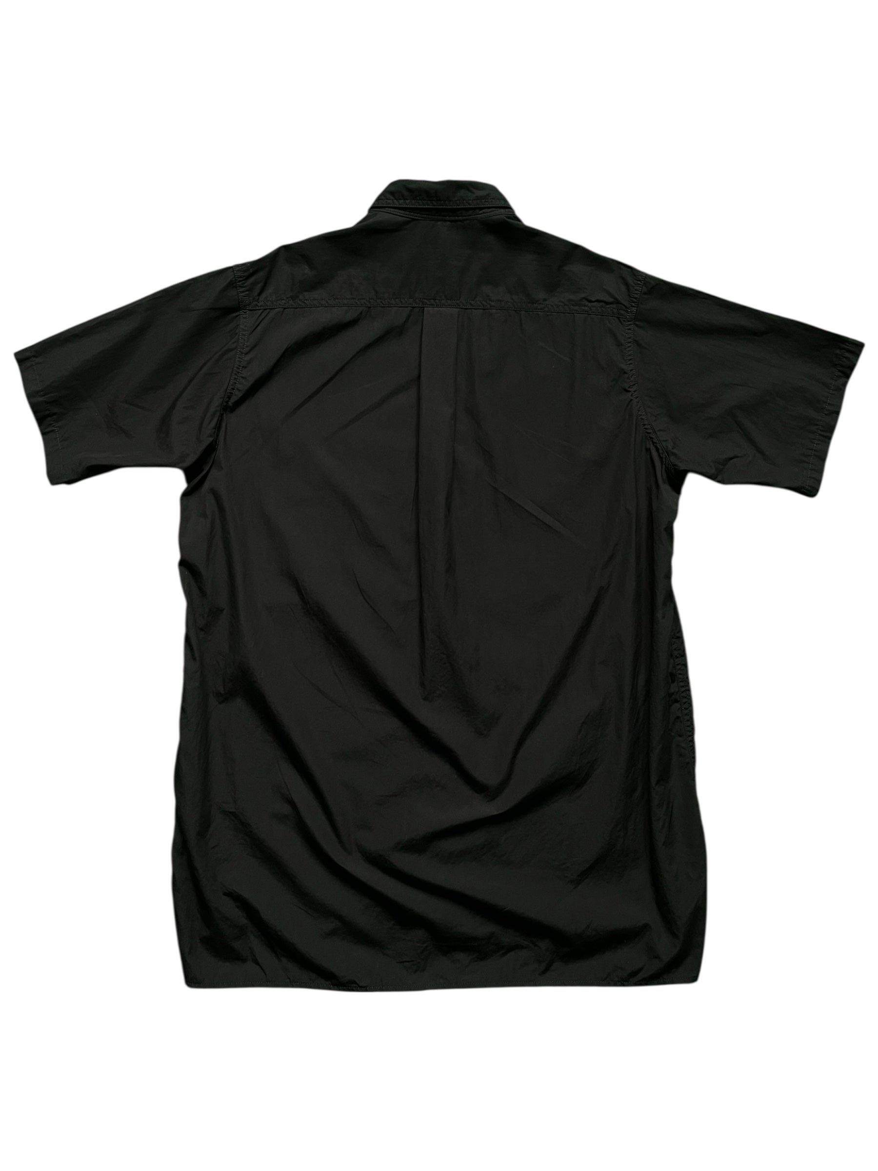 Black oversized shirt by Yohji Yamamoto from AW22 collection, shown laid flat with long sleeves and a classic collar.