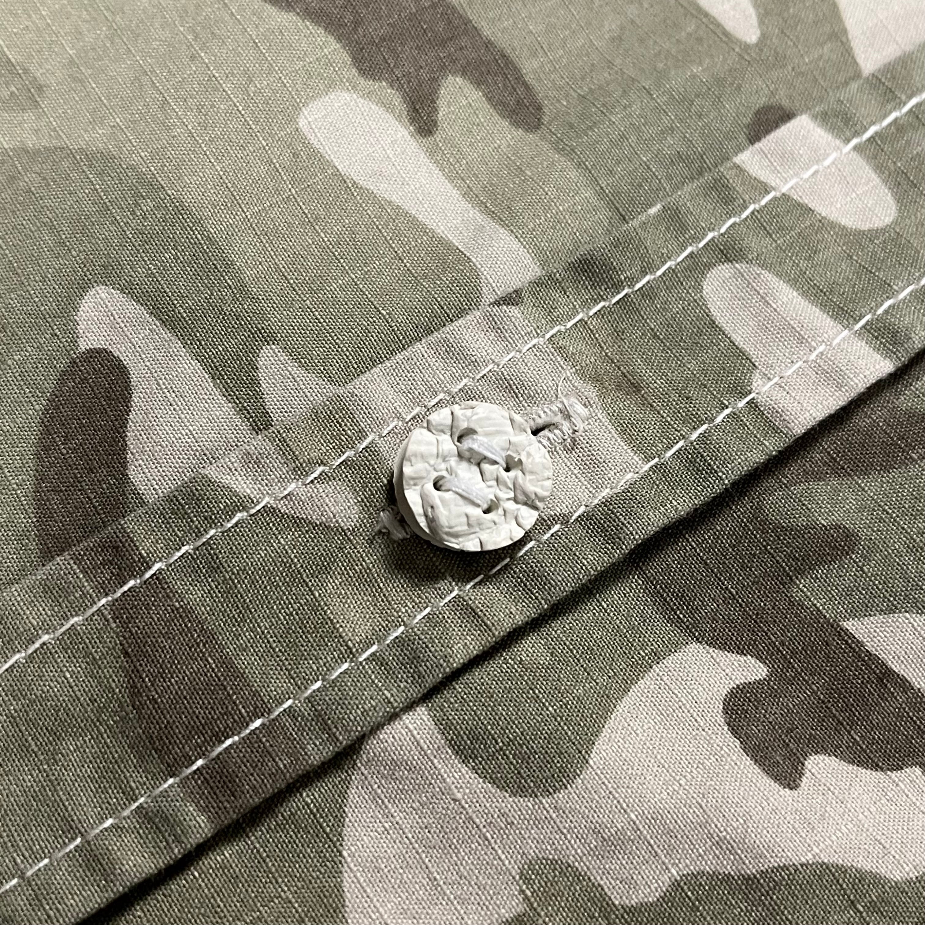 Comme des Garçons Homme Plus AW11 Ripstop Camo Shirt featuring a camouflage pattern and rugged ripstop fabric.