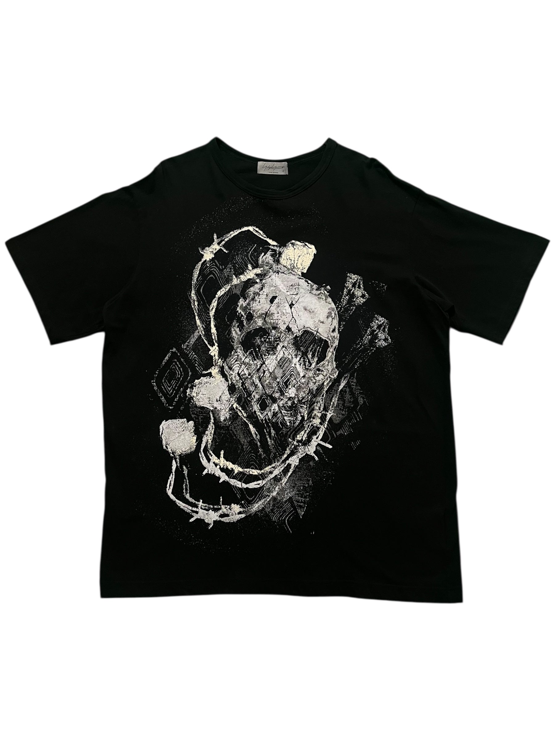 Yohji Yamamoto SS23 Skull T-Shirt featuring a black fabric with a skull graphic design on the front.