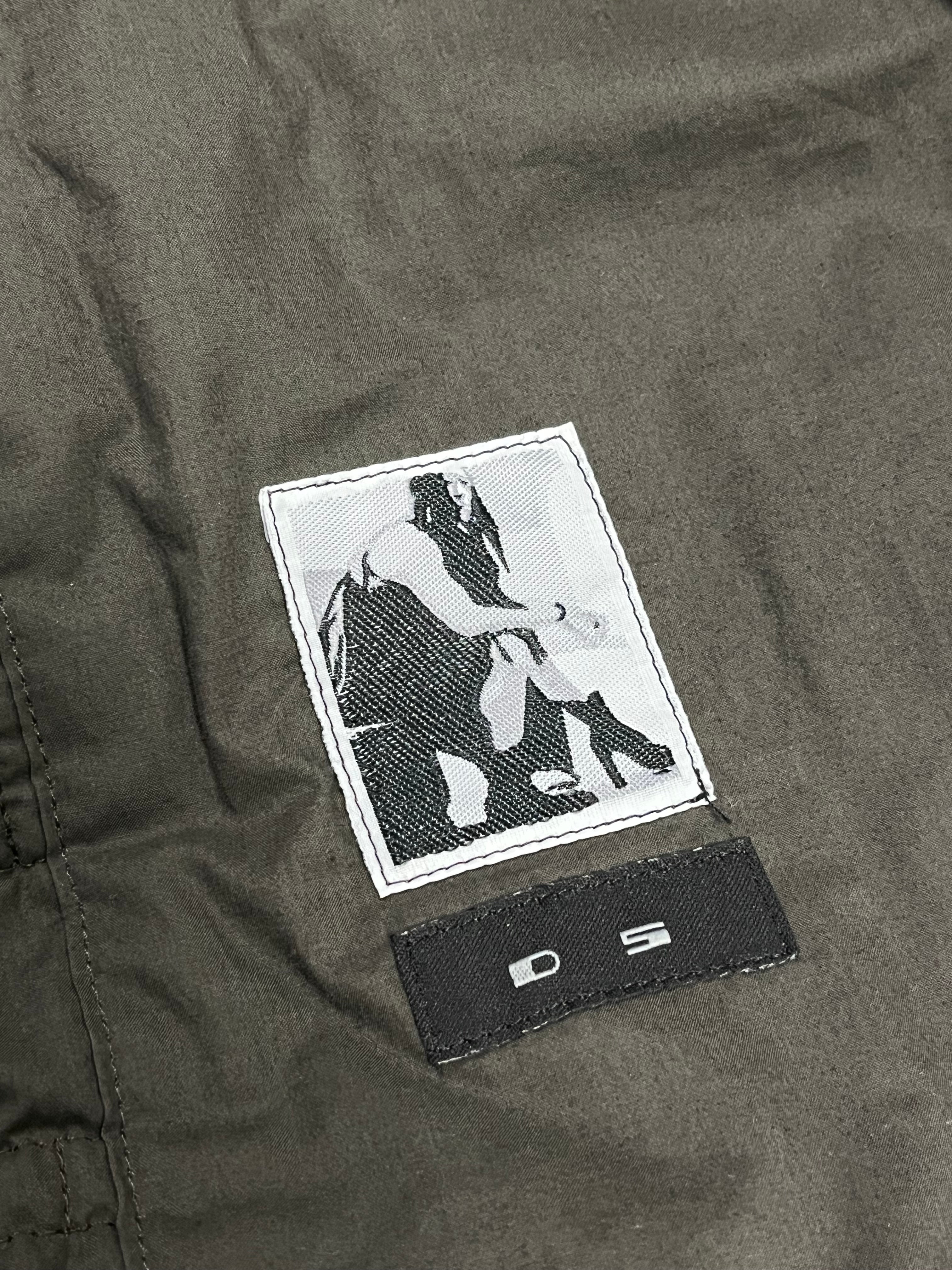 Rick Owens FW16 DRKSHDW Exploder bomber jacket, black with distressed details, displayed on a hanger against a neutral background.