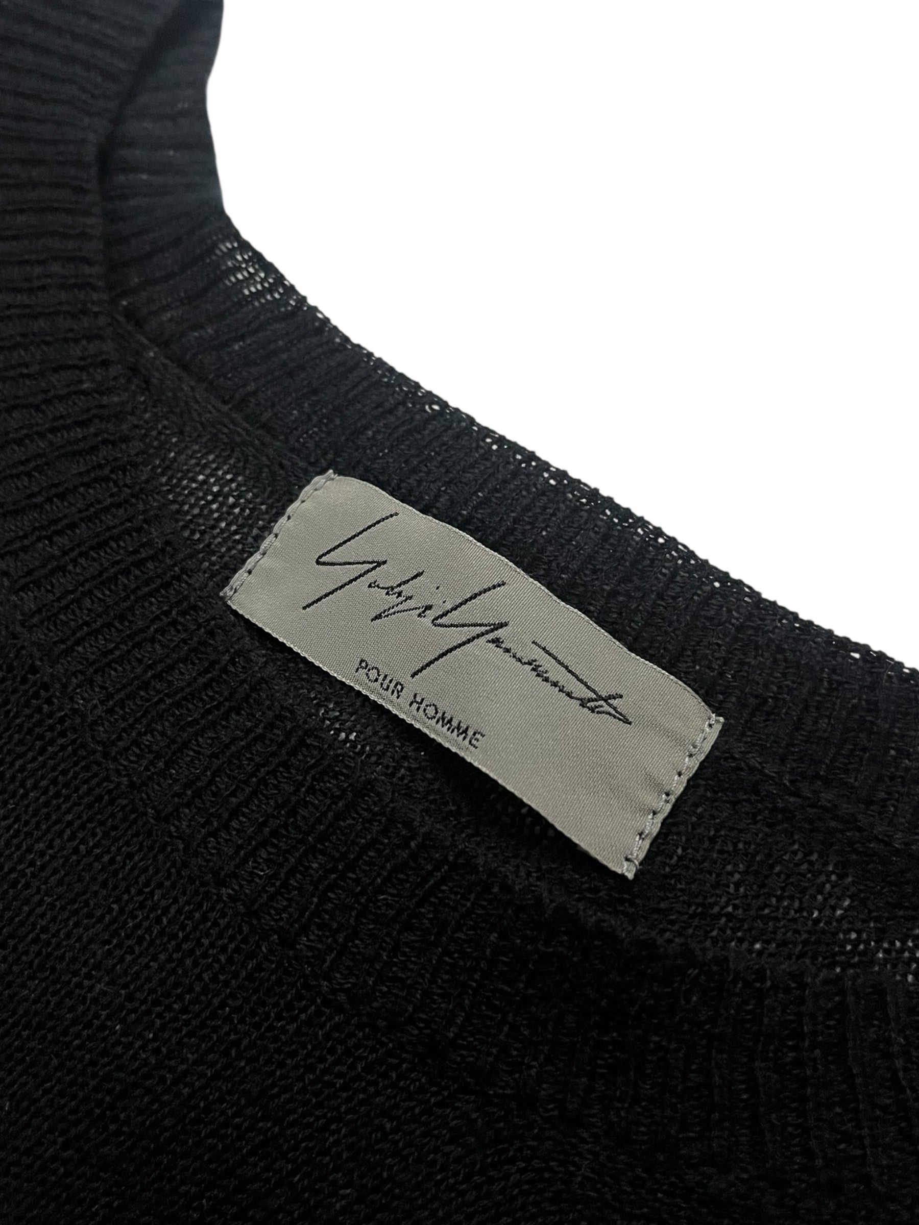 Yohji Yamamoto AW03 raglan knit long sleeve sweater in black with contrasting sleeves and a relaxed fit.
