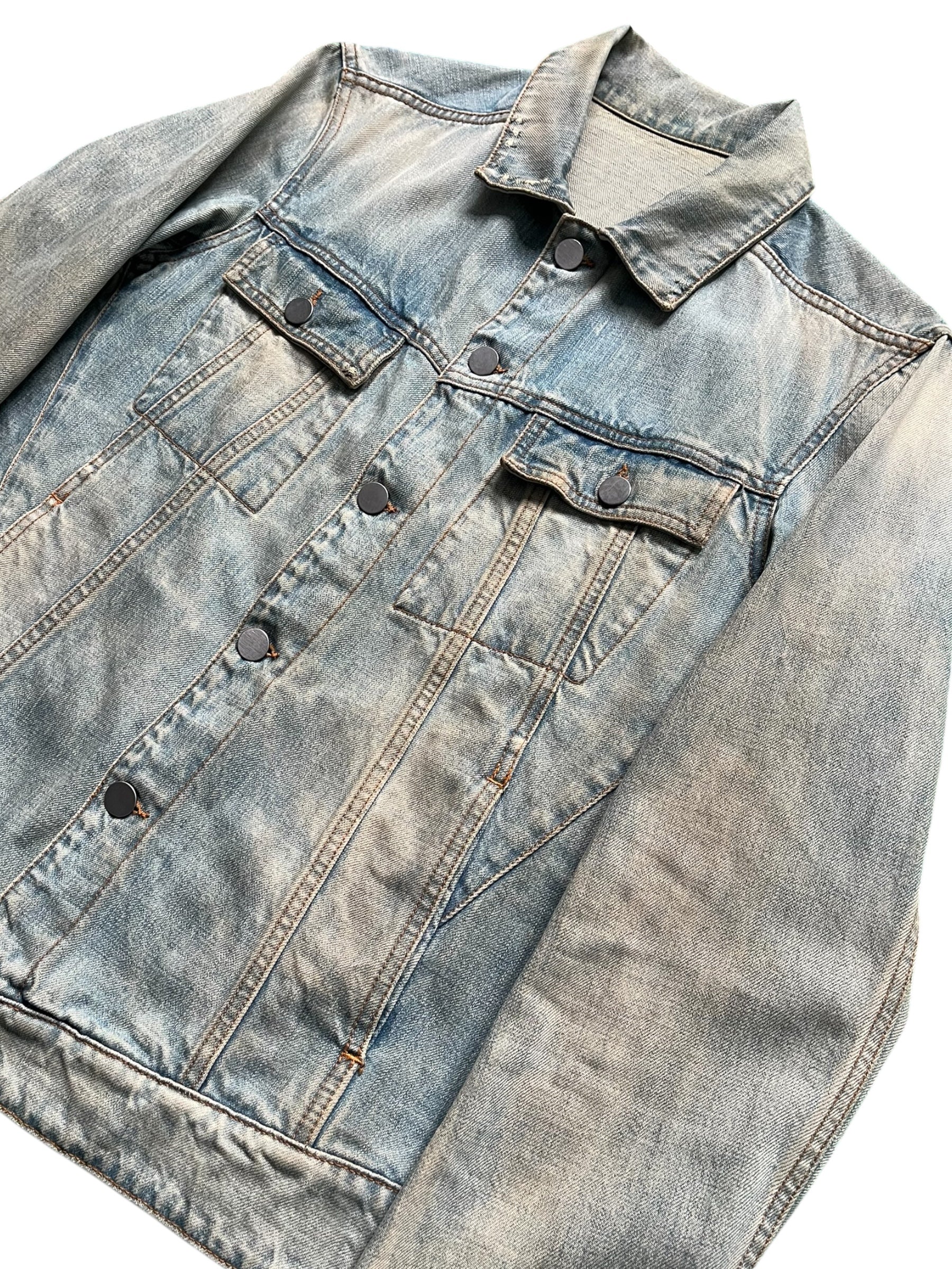 Balmain SS12 G-Dragon Mud Wash Denim Jacket showing front view with classic denim style and subtle branding details.