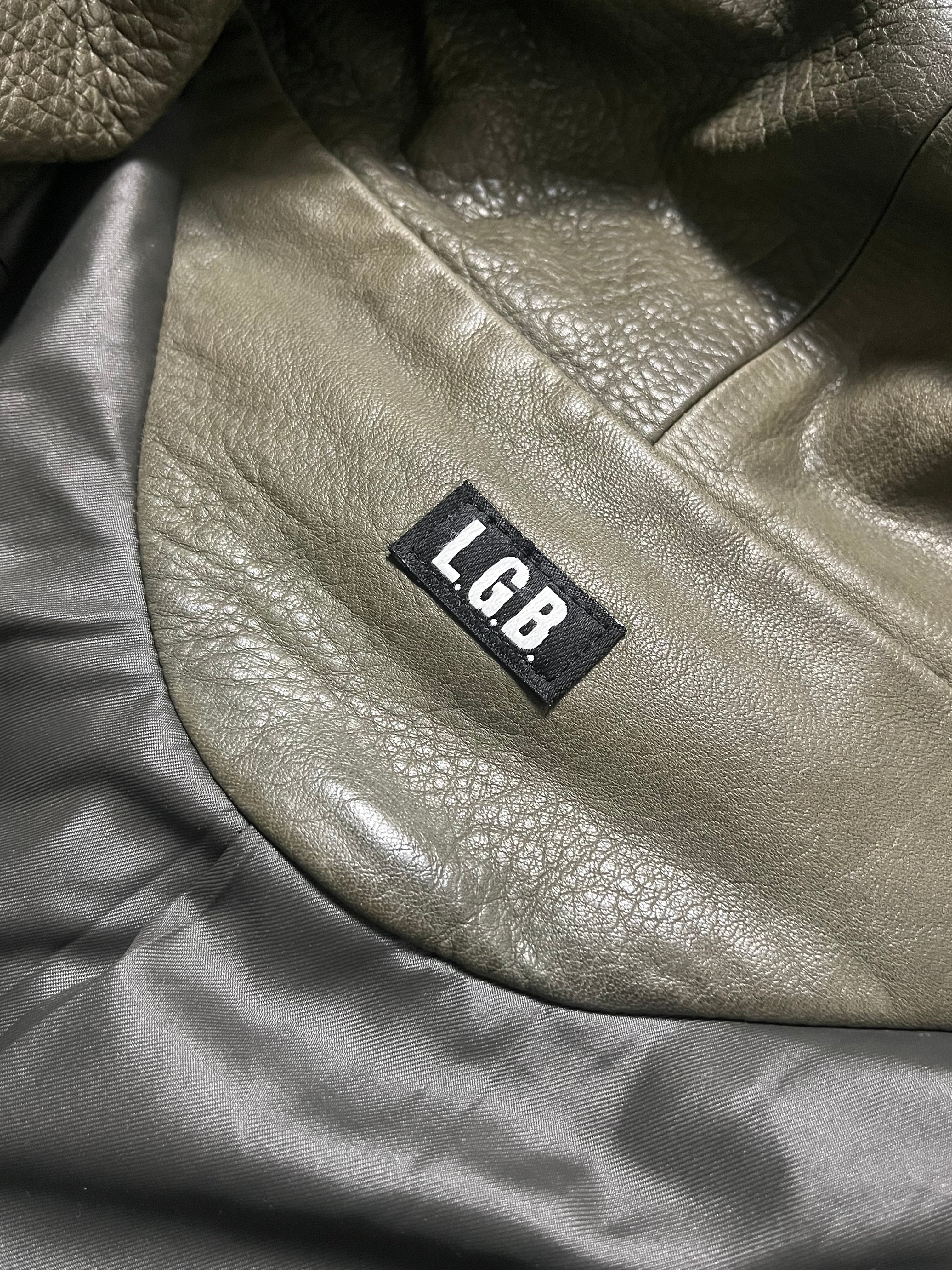 Le Grande Bleu Bono green leather jacket, 00s style, shown on a hanger with detailed stitching and classic collar.