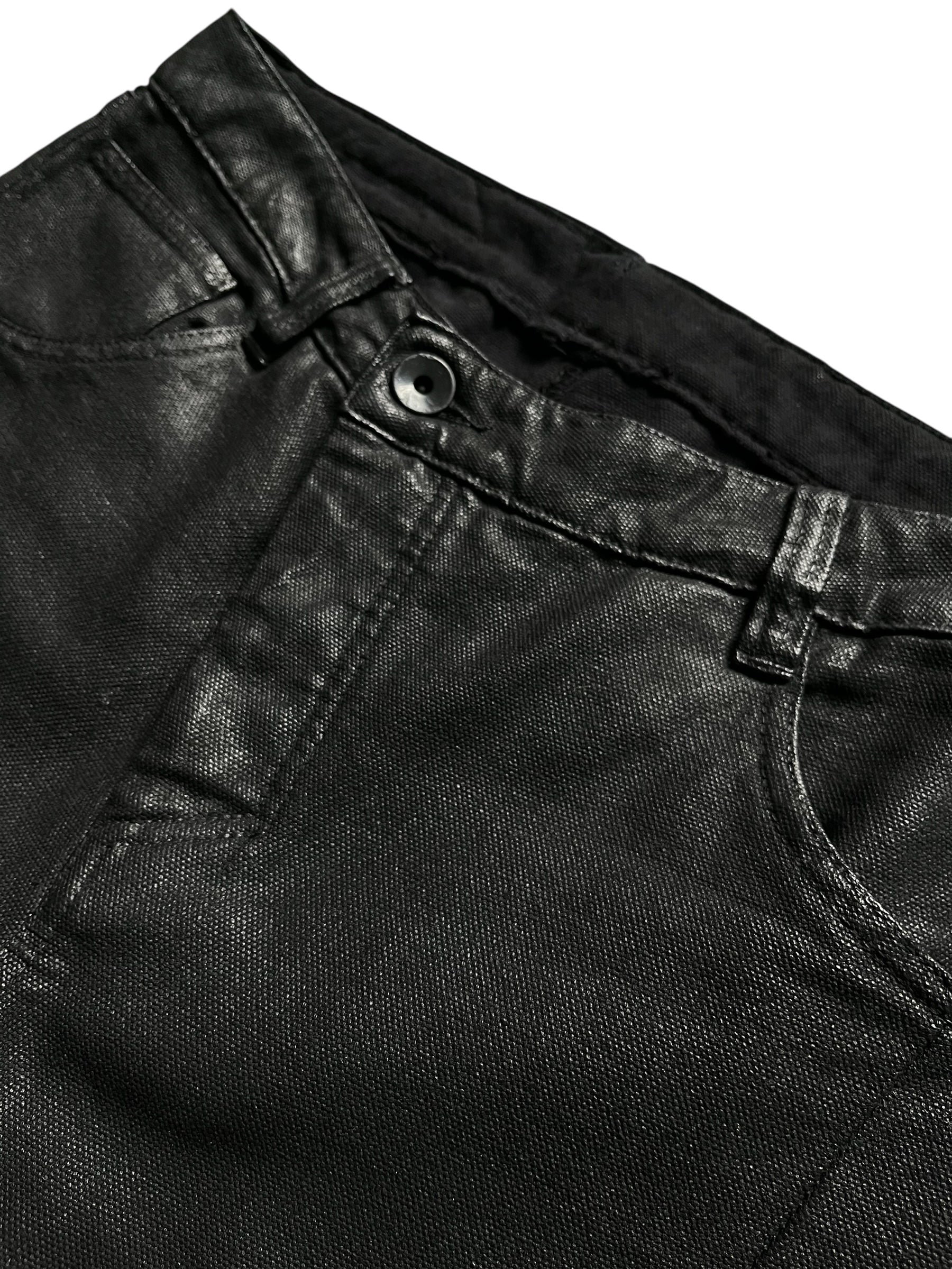 Boris Bidjan Saberi P-13 J-Cut waxed denim pants with distressed detailing and unique cut design on a model.