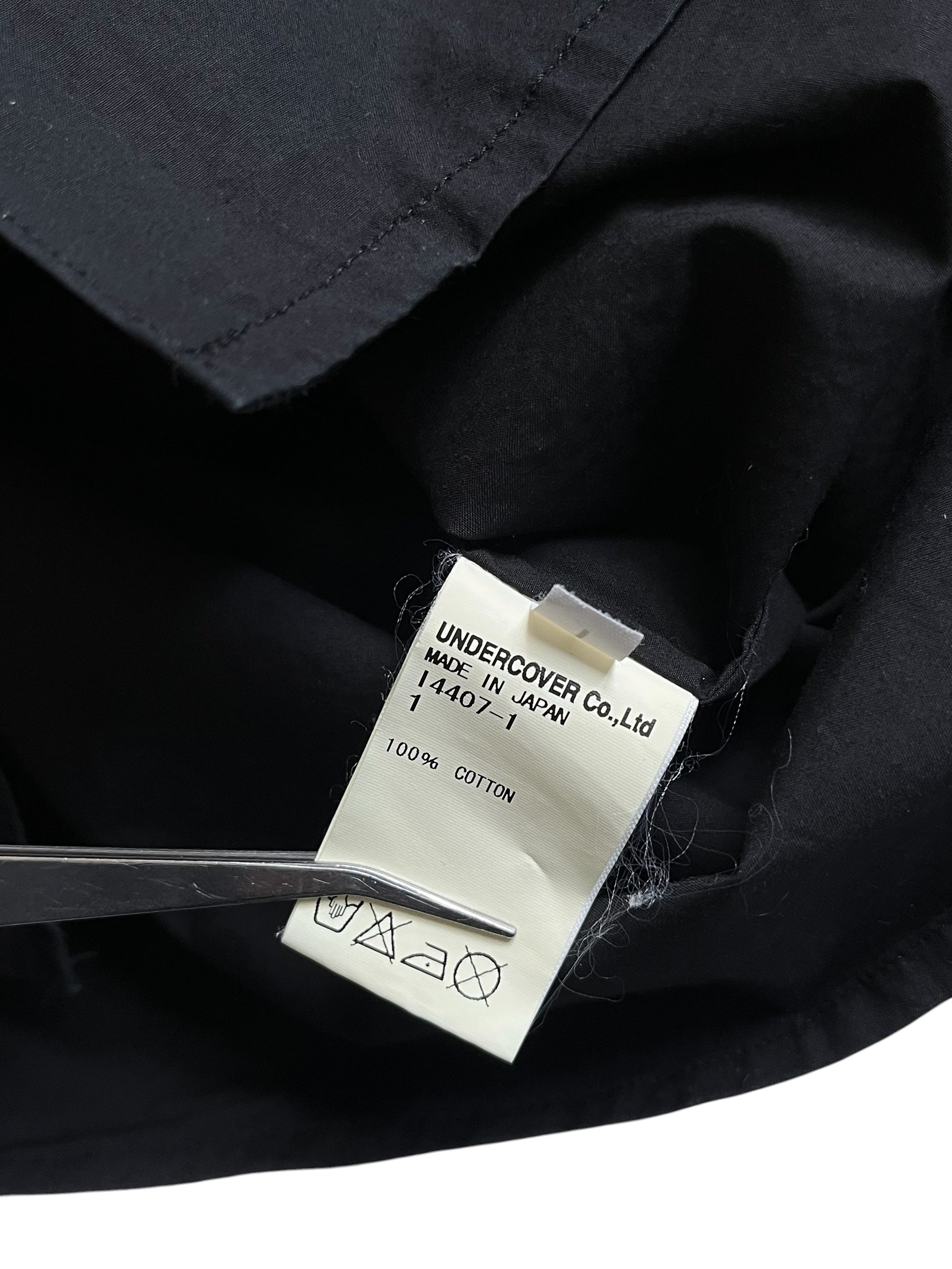 Undercover SS12 Openstrings She Brings The Rain shirt, lightweight fabric, with open-string details and rain-inspired design.