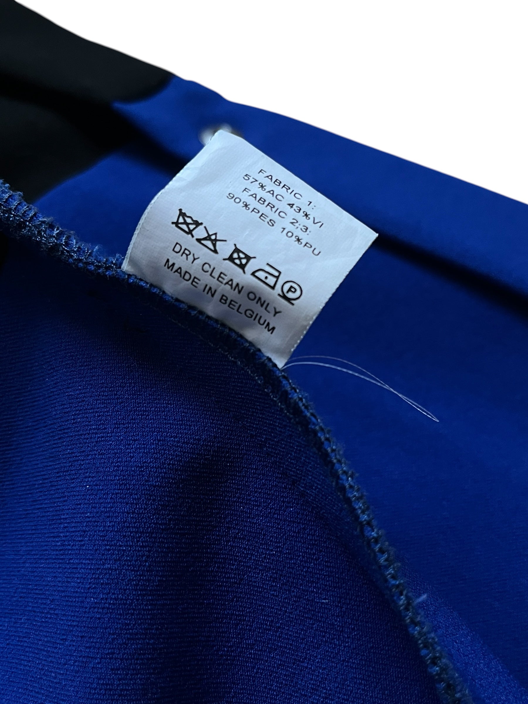 Raf Simons SS14 tri-color athletic long coat in blue, white, and black with a sleek, modern design and long silhouette.