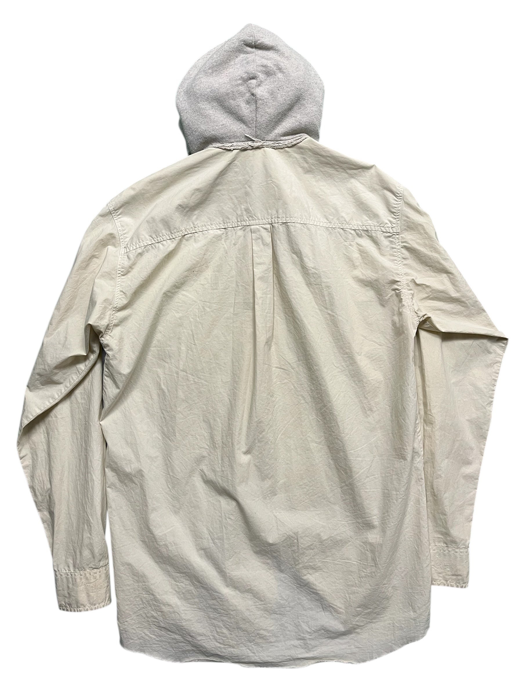 Raf Simons Virginia Creeper deep hooded shirt with dark fabric and relaxed fit, displayed on a hanger.