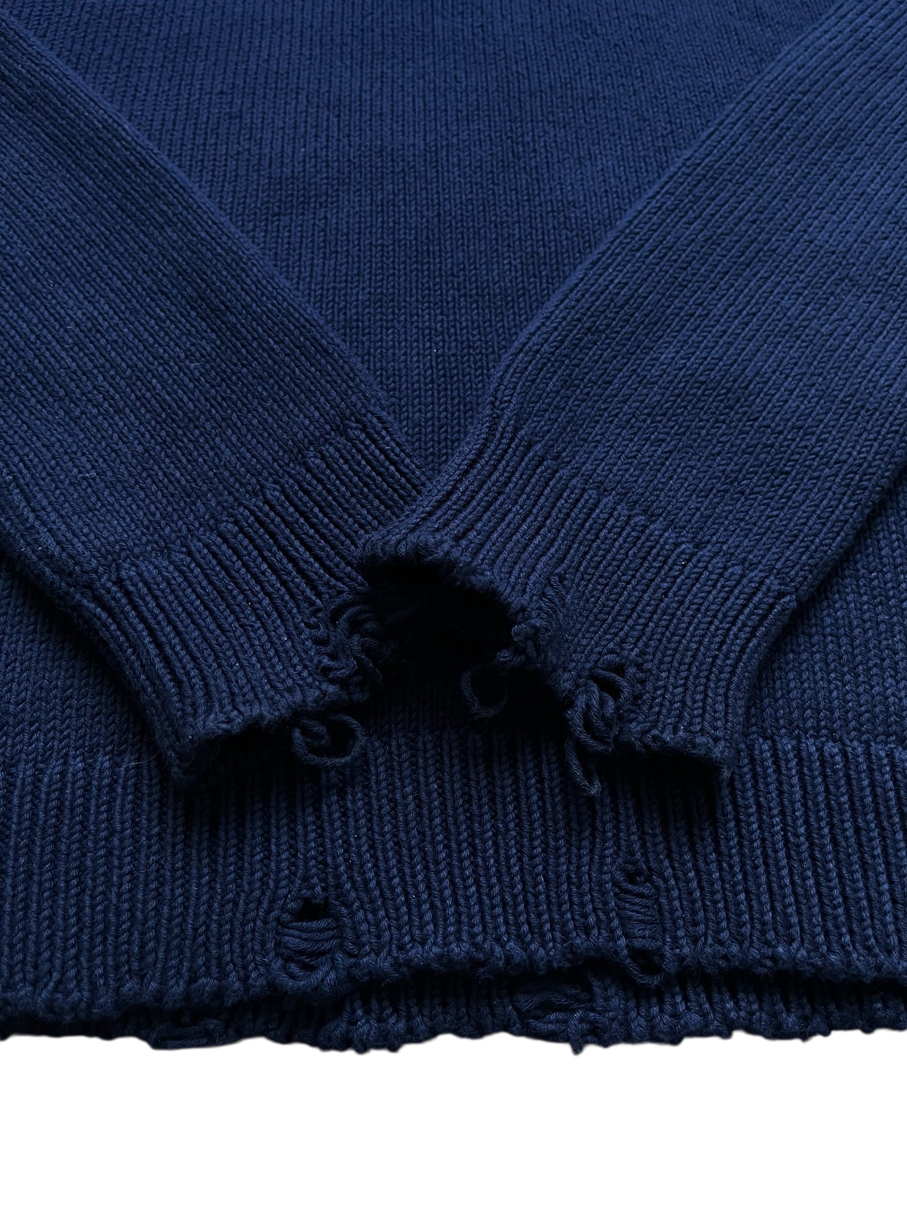 Saint Laurent AW23 distressed navy knit sweater with a cozy, textured design and distressed details.