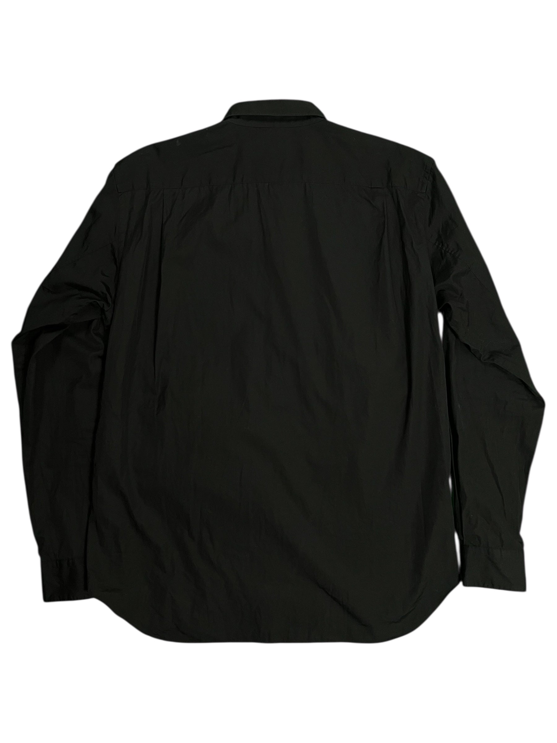 Comme des Garçons Homme Plus SS19 paneled shirt with mixed fabric panels and modern design details.