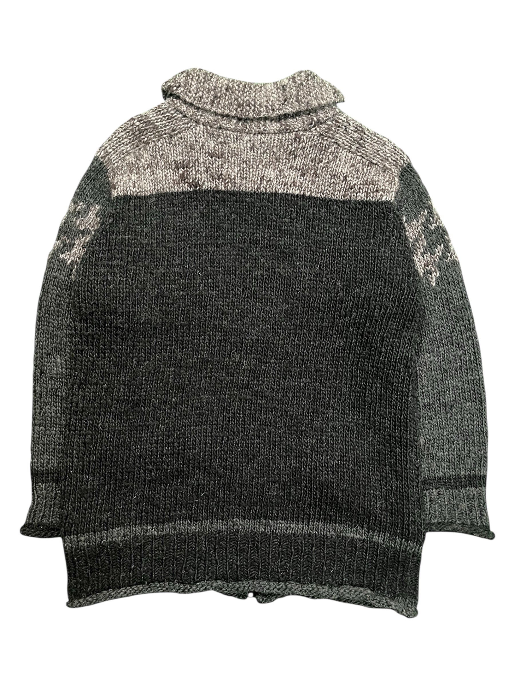 Yohji Yamamoto AW10 Cowichan knit jacket with a cozy, textured design in neutral tones, displayed on a hanger.