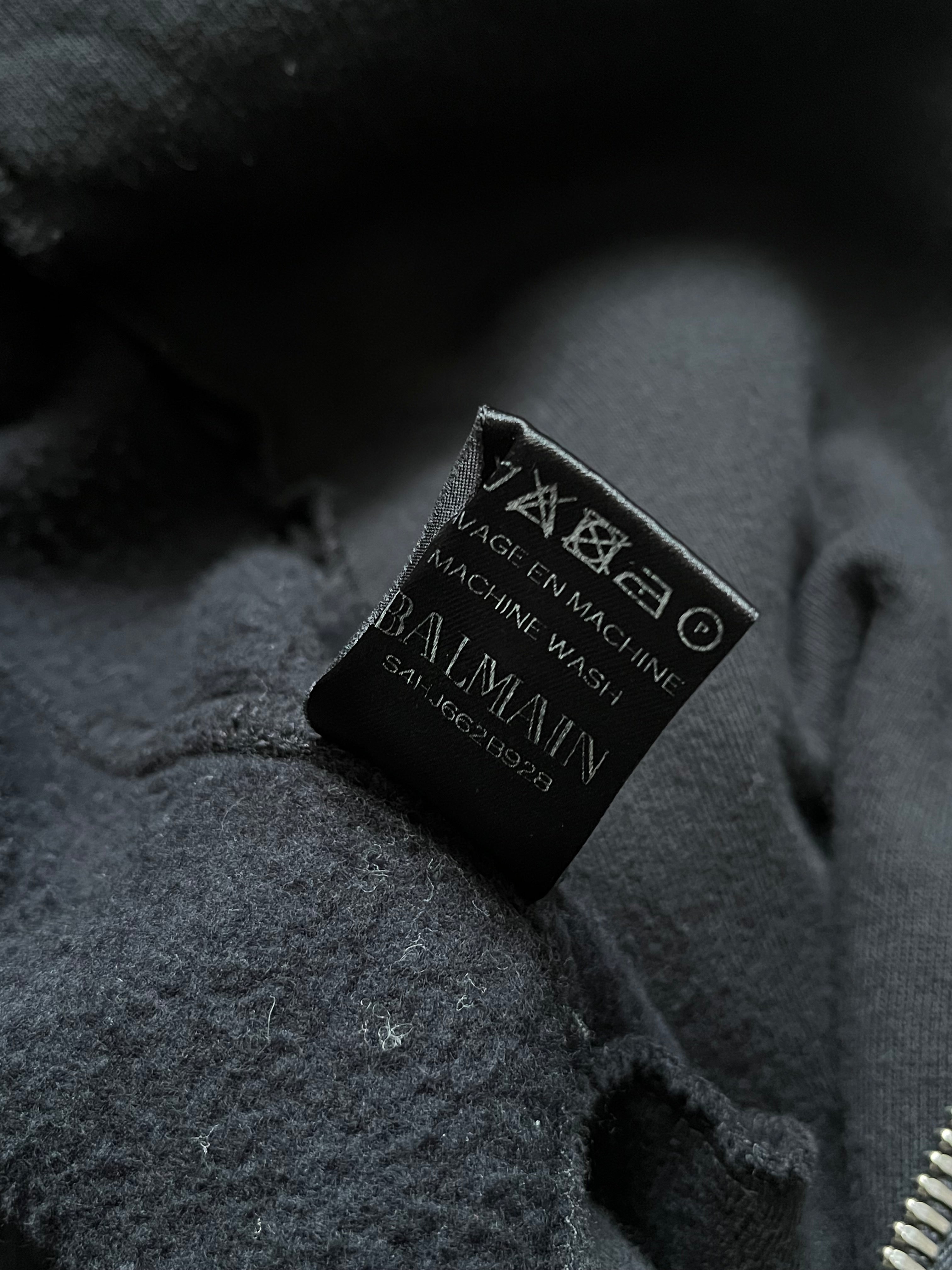 Balmain SS14 sweater biker jacket featuring a fitted design, zip closures, and stylish shoulder details.
