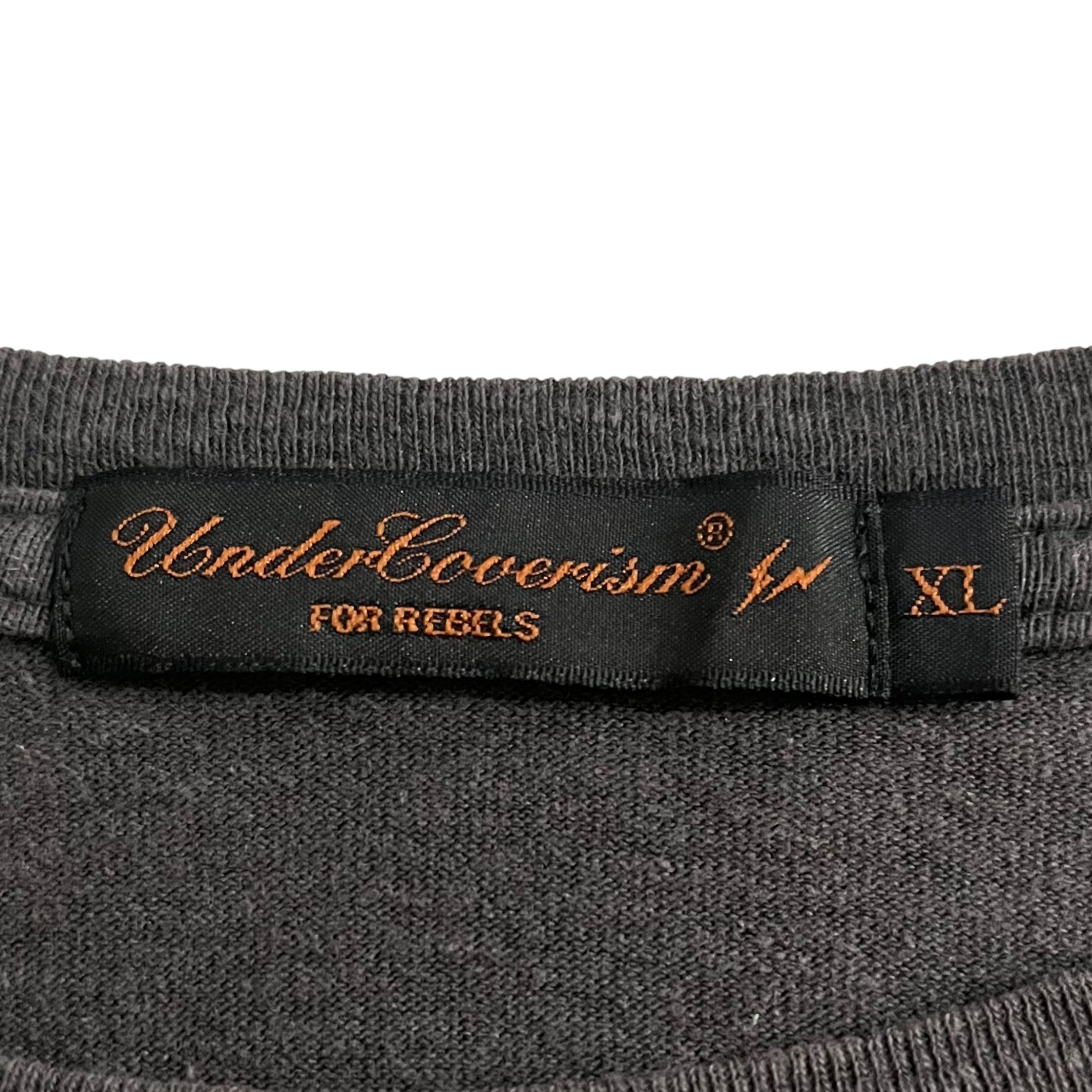 Undercover SS03 Fragment Design Bug T-Shirt featuring a graphic print on a casual black T-shirt.