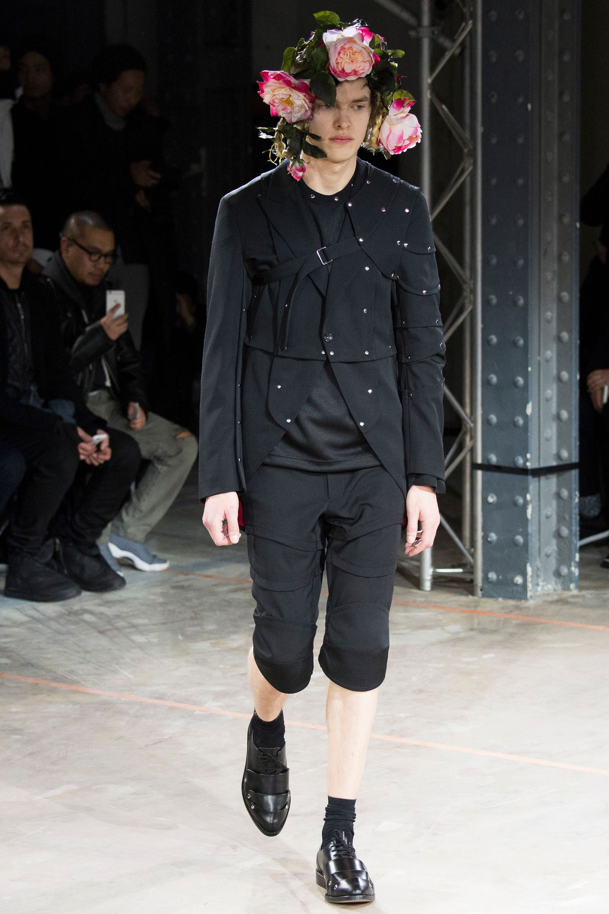 Comme des Garçons Homme Plus Armour Of Peace studded long sleeve shirt with metal embellishments and detailed design.