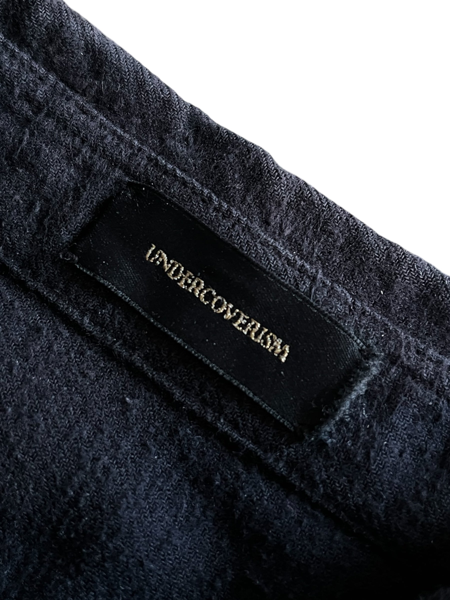 Undercover AW14 Cold Blood brushed cotton overshirt with a dark, textured fabric and button-front design.