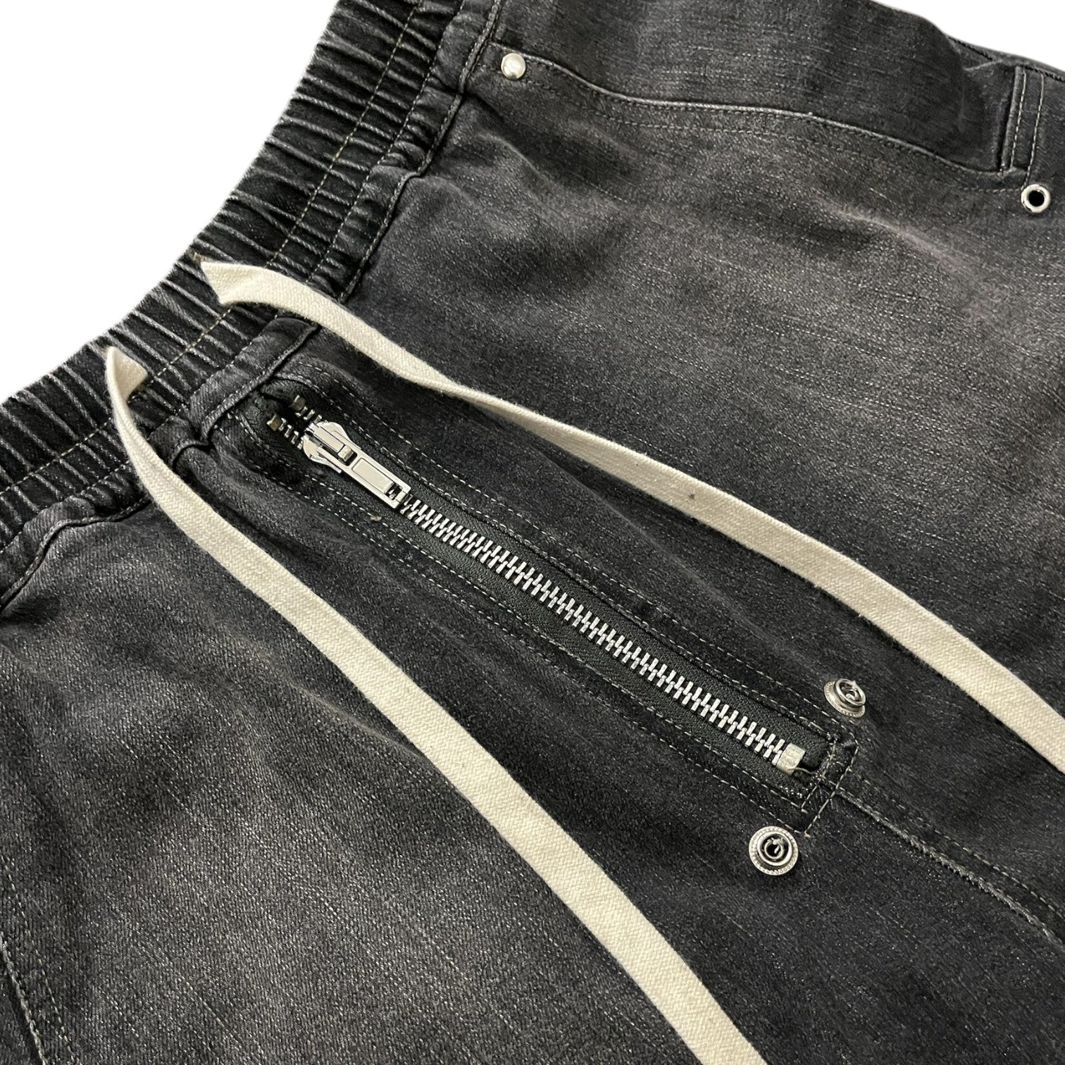 Rick Owens DRKSHDW Bella Double Cargo Denim pants with multiple pockets and a relaxed fit, shown on a model.