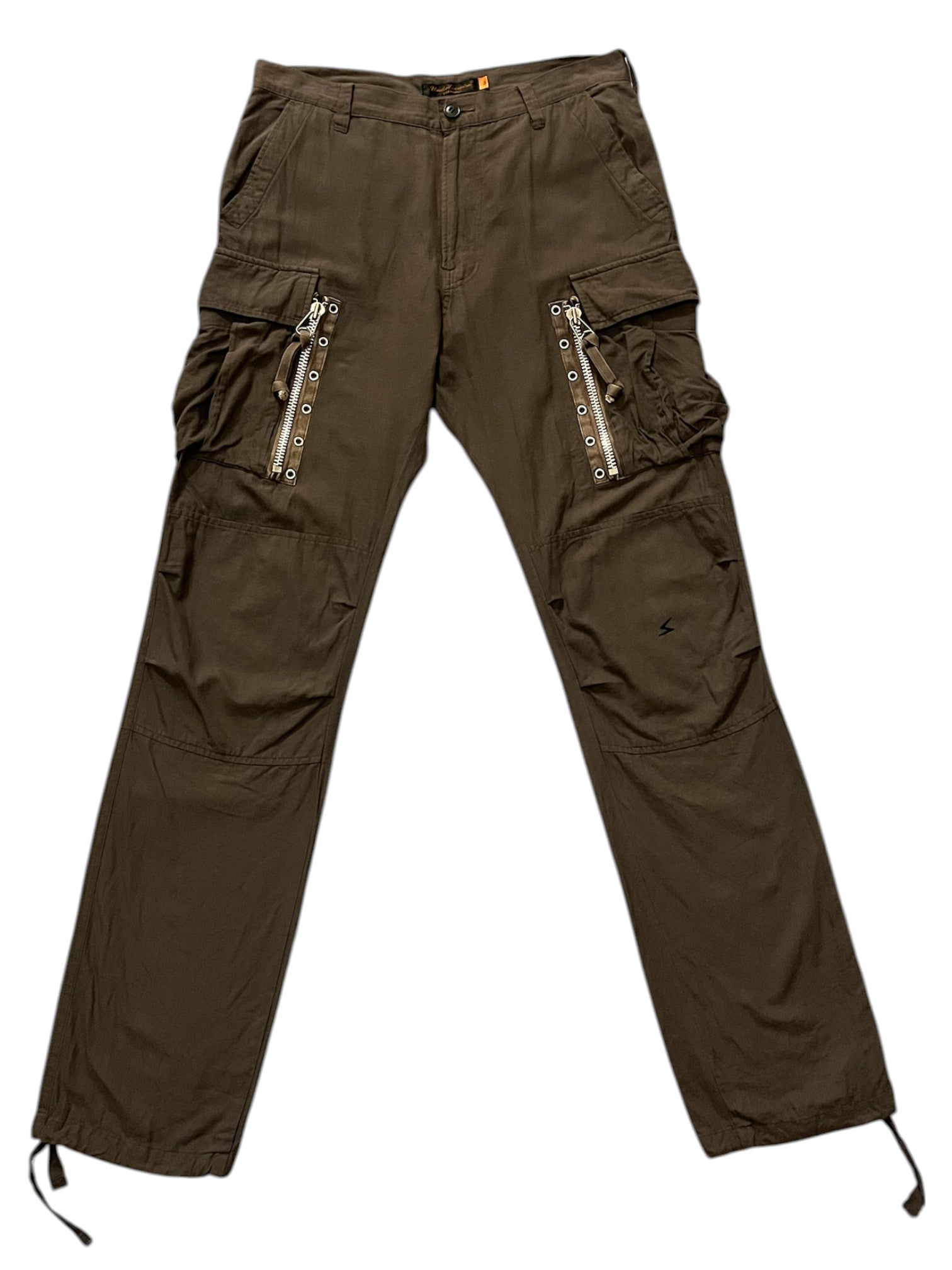 Undercover SS06 “T” military cargo pants with multiple pockets and rugged design, shown in a neutral stance.