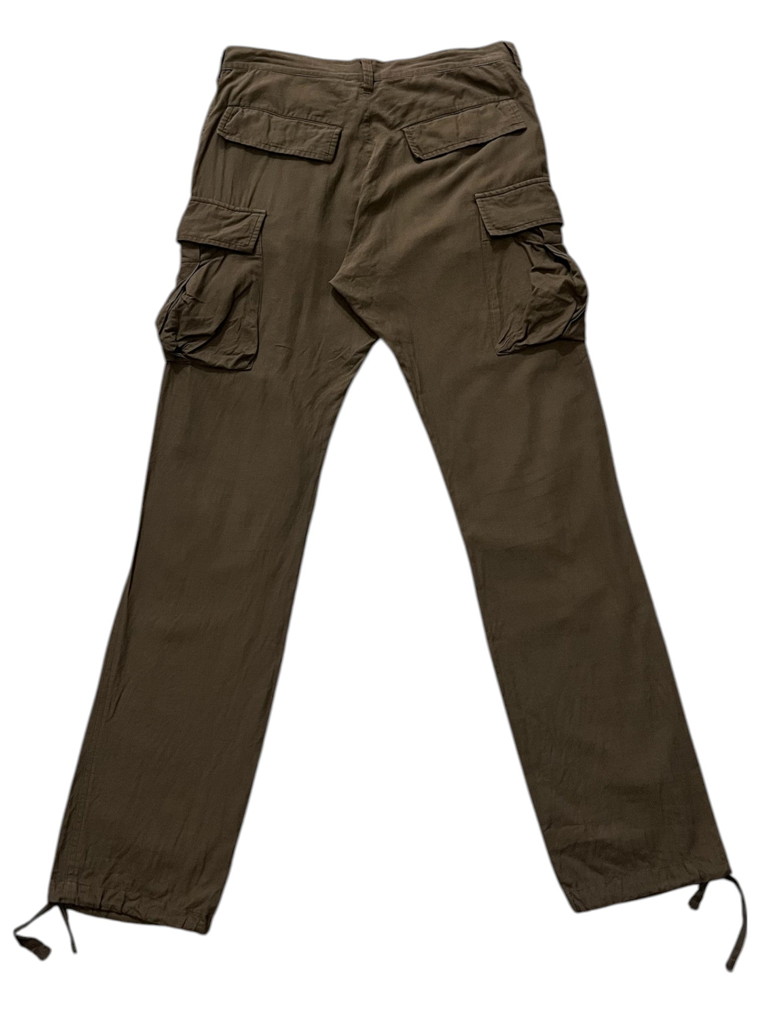 Undercover SS06 “T” military cargo pants, olive green with multiple pockets, casual streetwear style, shown on a model.