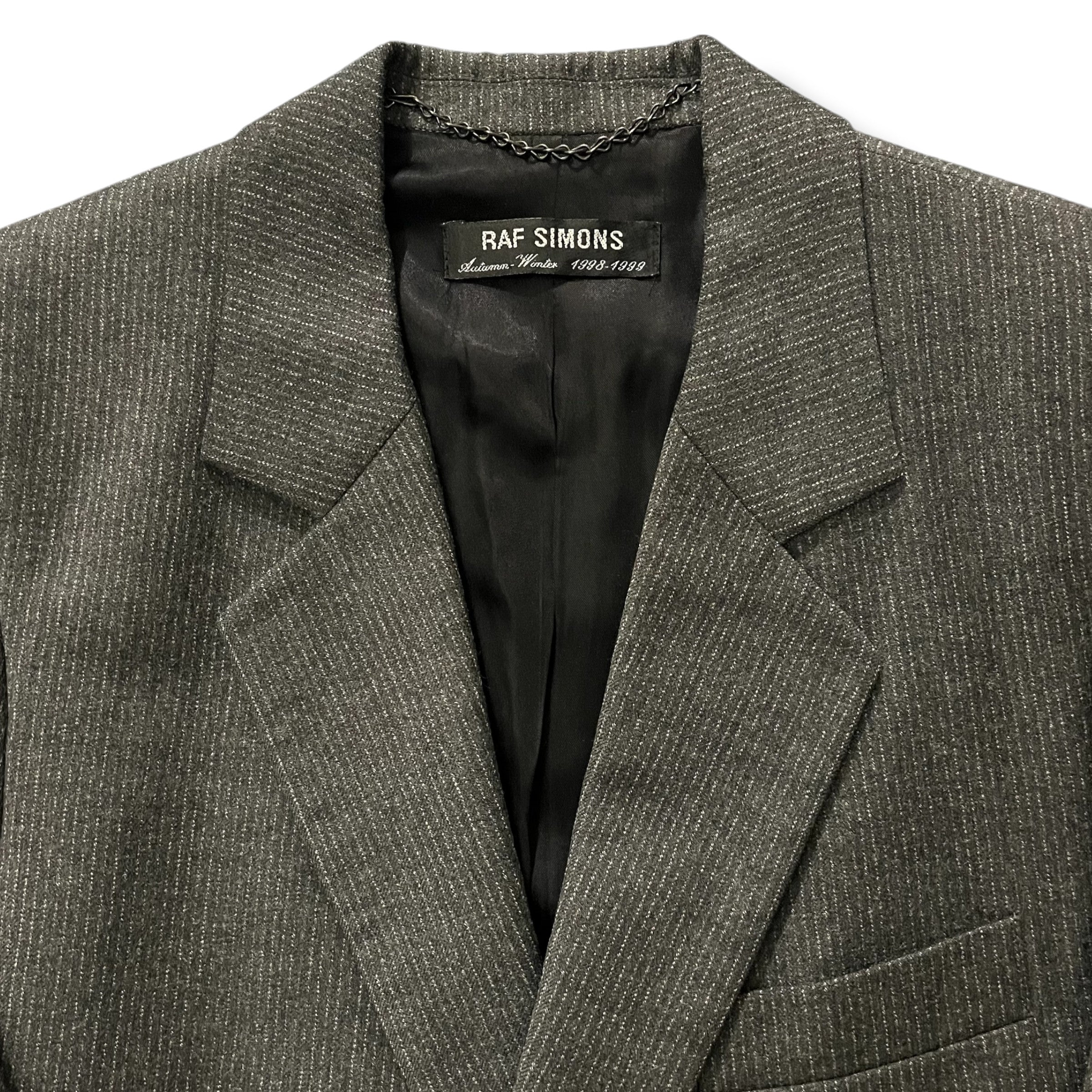 Raf Simons AW98-99 Radioactivity cashmere trench coat, stylish jacket with a sleek design and detailed fabric texture.