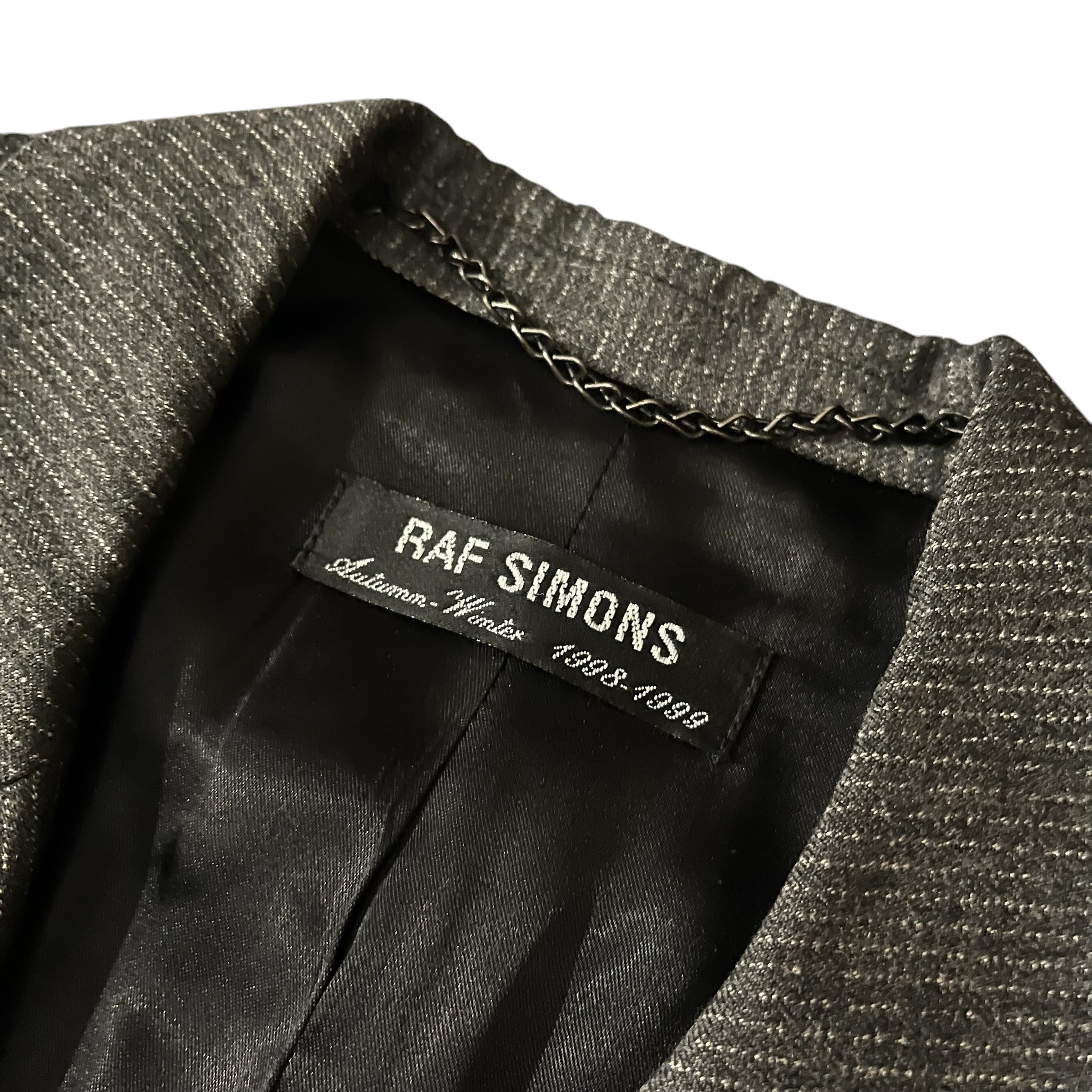Raf Simons AW98-99 "Radioactivity" cashmere trench coat, stylish jacket with a sleek design and detailed fabric texture.